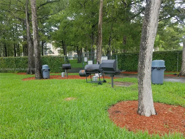 a view of a chair and table in the garden