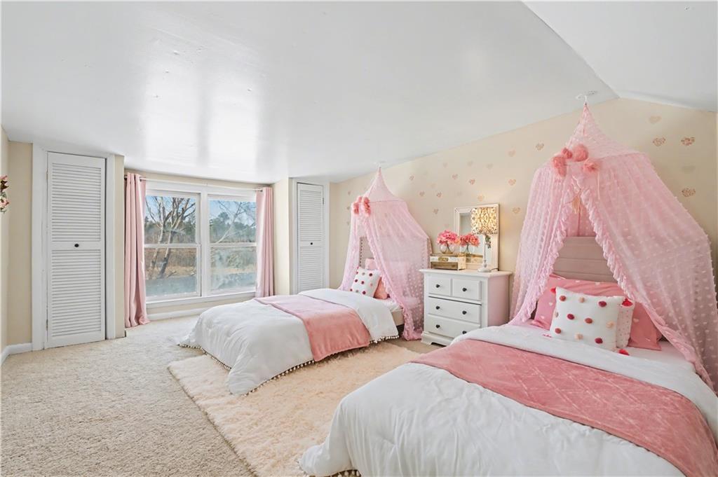 1833 Tom Odum Road Vidalia, GA 30474 - Photo 34 of 59 a bedroom with two bed and a large window