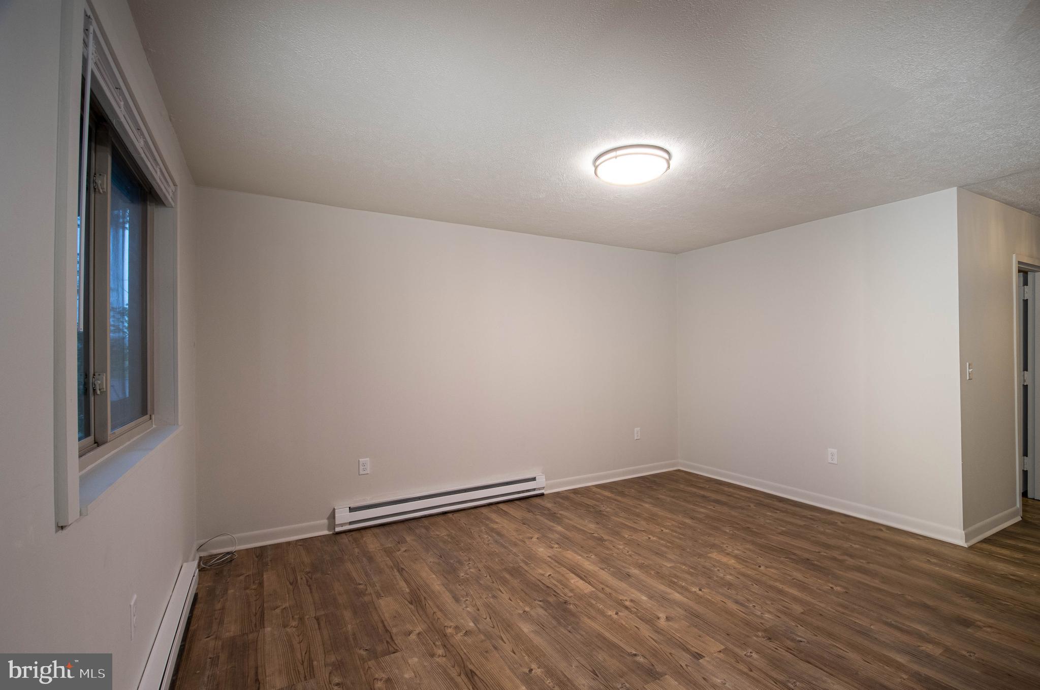 1724 Mosser Road, Unit 1 McHenry, MD 21541 - Photo 11 of 24 wooden floor in an empty room