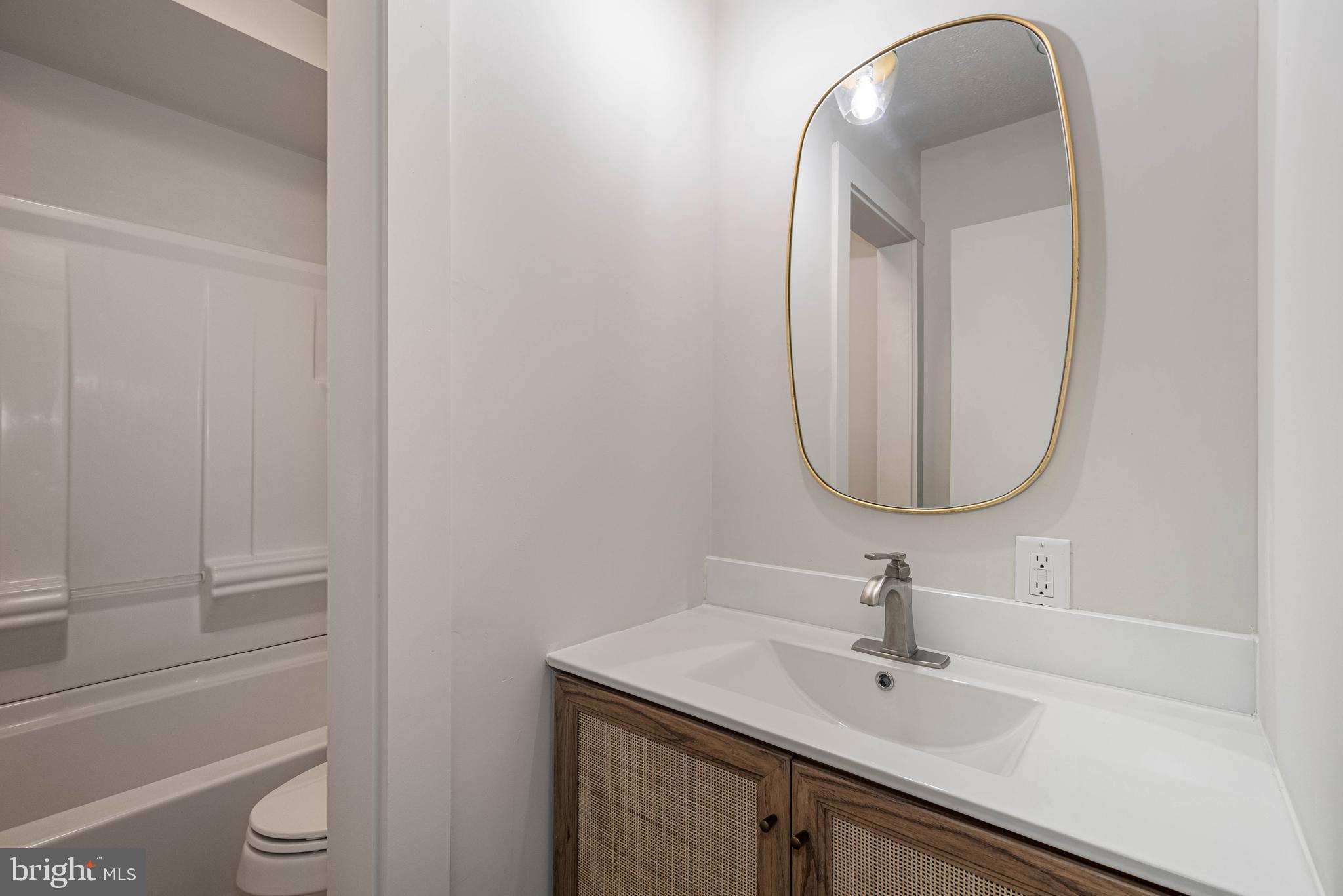 1724 Mosser Road, Unit 1 McHenry, MD 21541 - Photo 16 of 24 a bathroom with a sink and a mirror