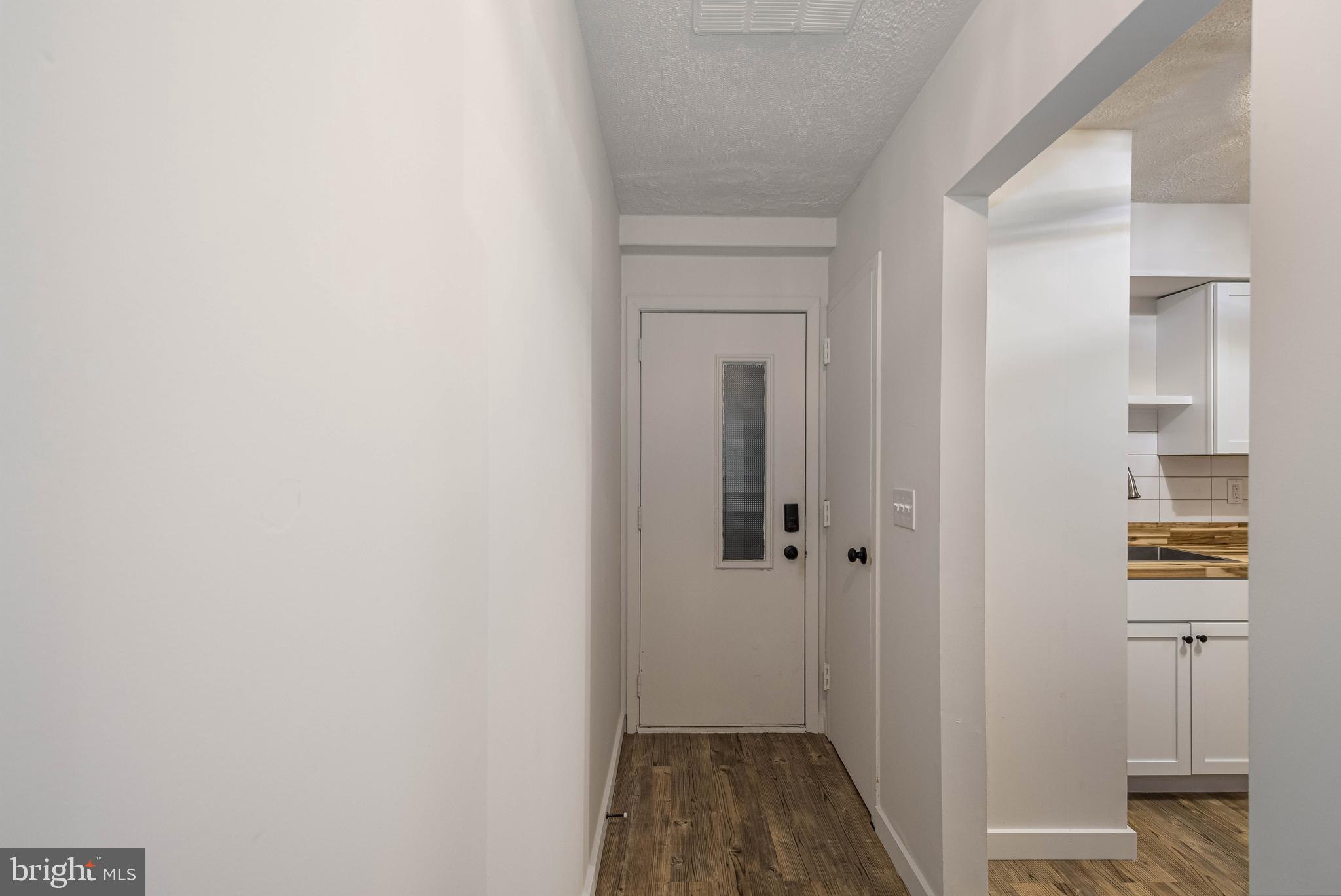 1724 Mosser Road, Unit 1 McHenry, MD 21541 - Photo 18 of 24 a view of a hallway with wooden floor and closet