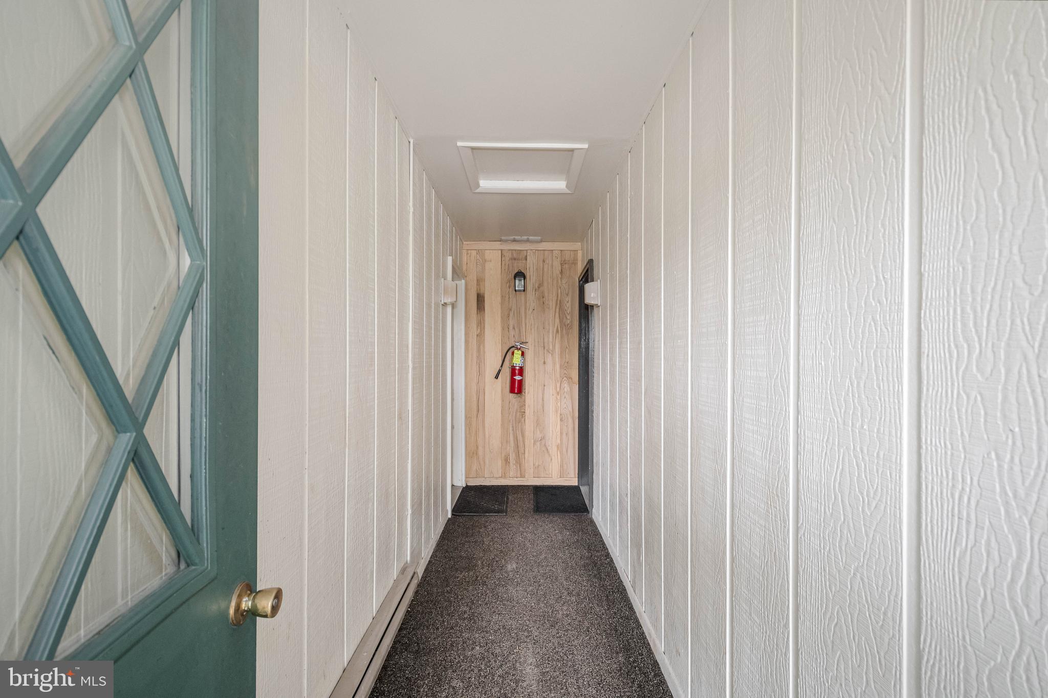 1724 Mosser Road, Unit 1 McHenry, MD 21541 - Photo 19 of 24 a view of a hallway with wooden floor and stairs
