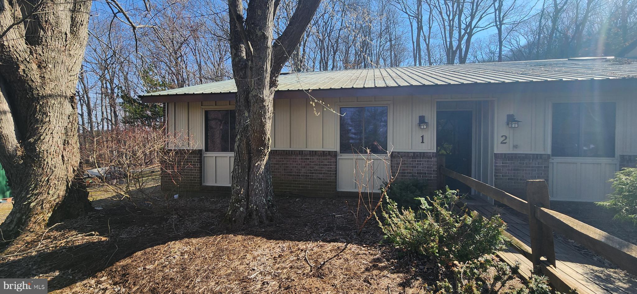 1724 Mosser Road, Unit 1 McHenry, MD 21541 - Photo 22 of 24 a front view of a house with garden