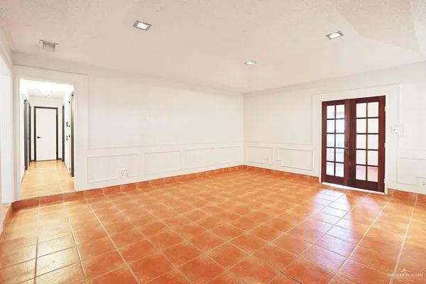 a view of an empty room and window