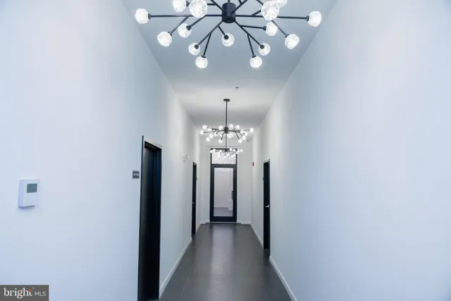a view of a chandelier in a hallway