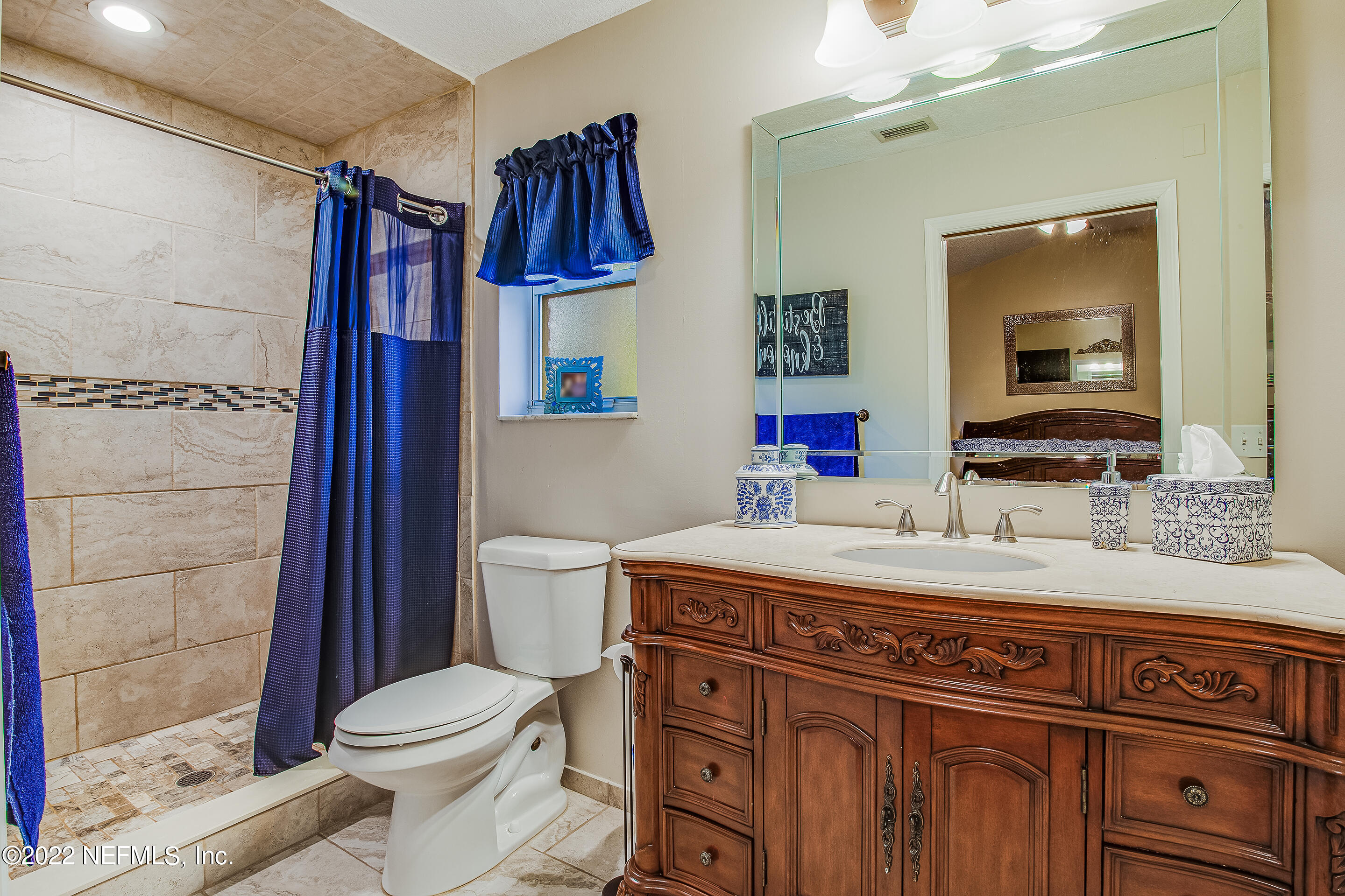 55525 Deer Run Road Callahan, FL 32011 - Photo 15 of 31 a bathroom with a sink a toilet and shower