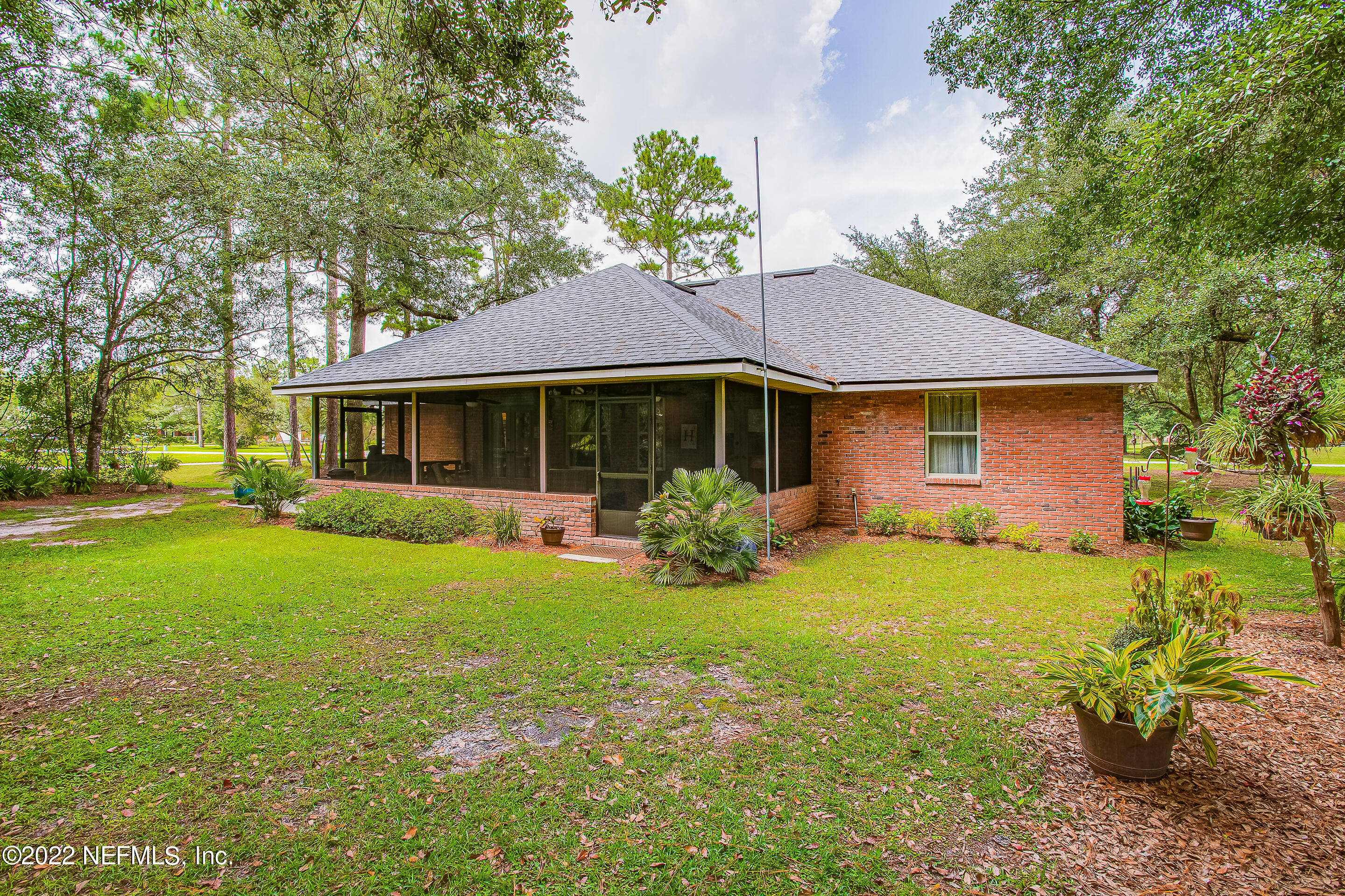 55525 Deer Run Road Callahan, FL 32011 - Photo 28 of 31 a front view of a house with a garden
