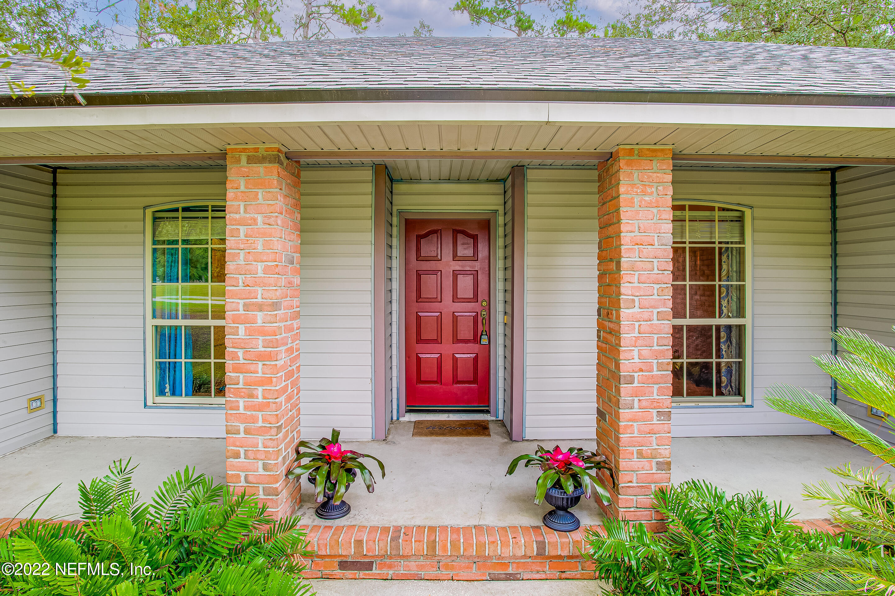 55525 Deer Run Road Callahan, FL 32011 - Photo 7 of 31 a front view of a house with an outdoor space