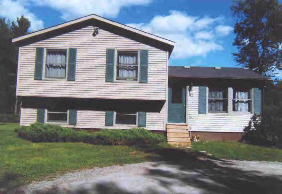 41 Chestnut Hill Road Monterey, MA 01245 - Photo 1 of 4 a front view of a house with a yard