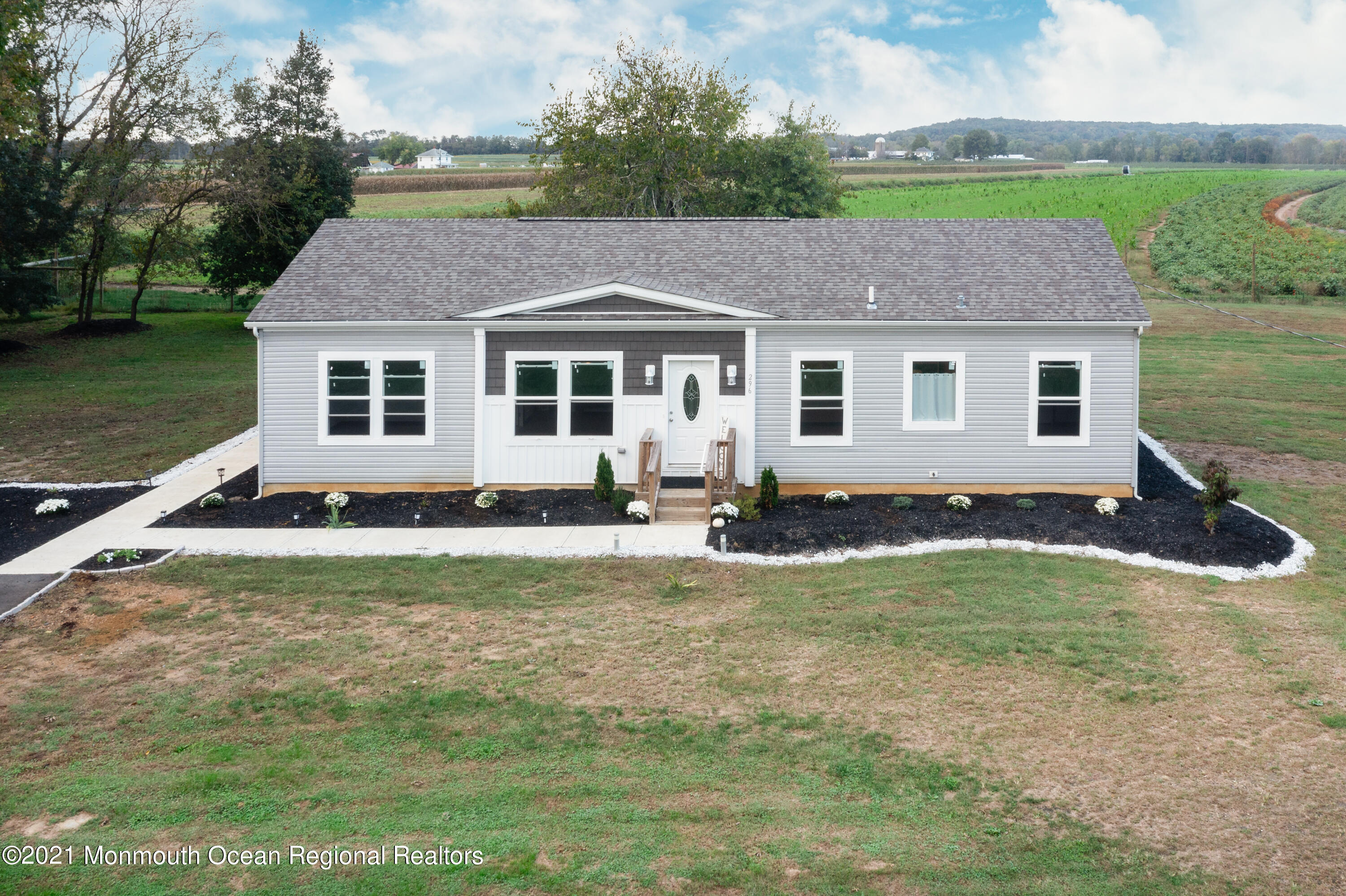 296 Trenton Lakewood Road Cream Ridge, NJ 08514 - Photo 1 of 35 a front view of a house with a yard
