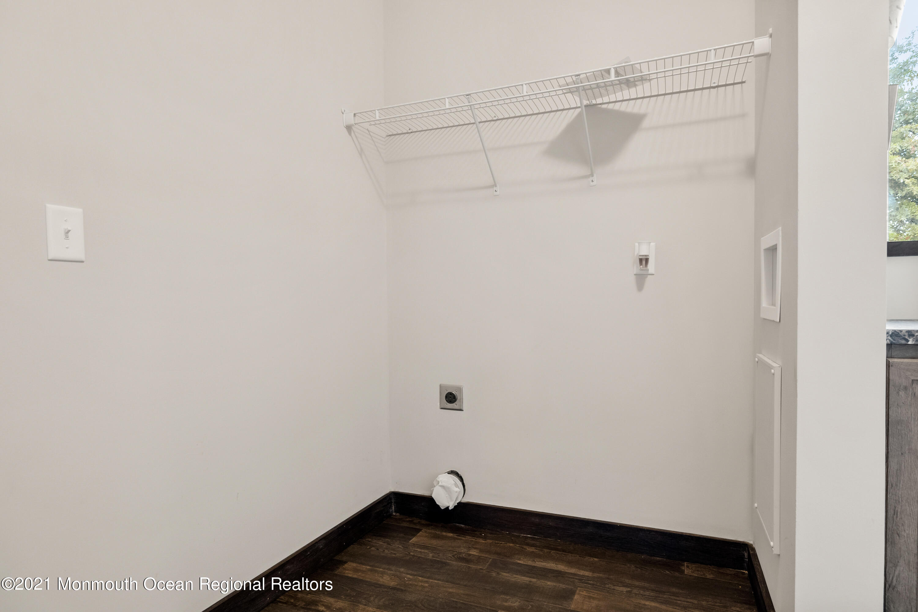 296 Trenton Lakewood Road Cream Ridge, NJ 08514 - Photo 18 of 35 a view of a room with racks on the wall