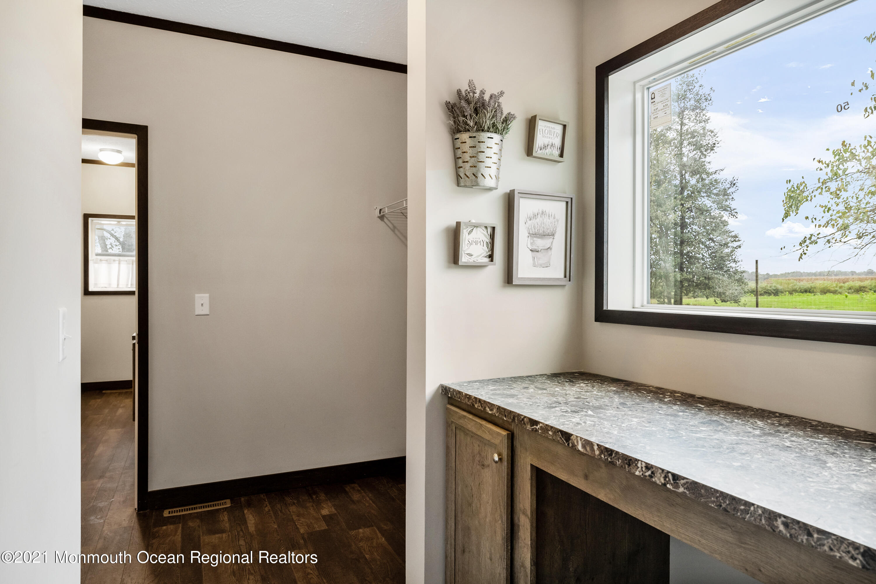 296 Trenton Lakewood Road Cream Ridge, NJ 08514 - Photo 19 of 35 a view of hallway with wooden floor