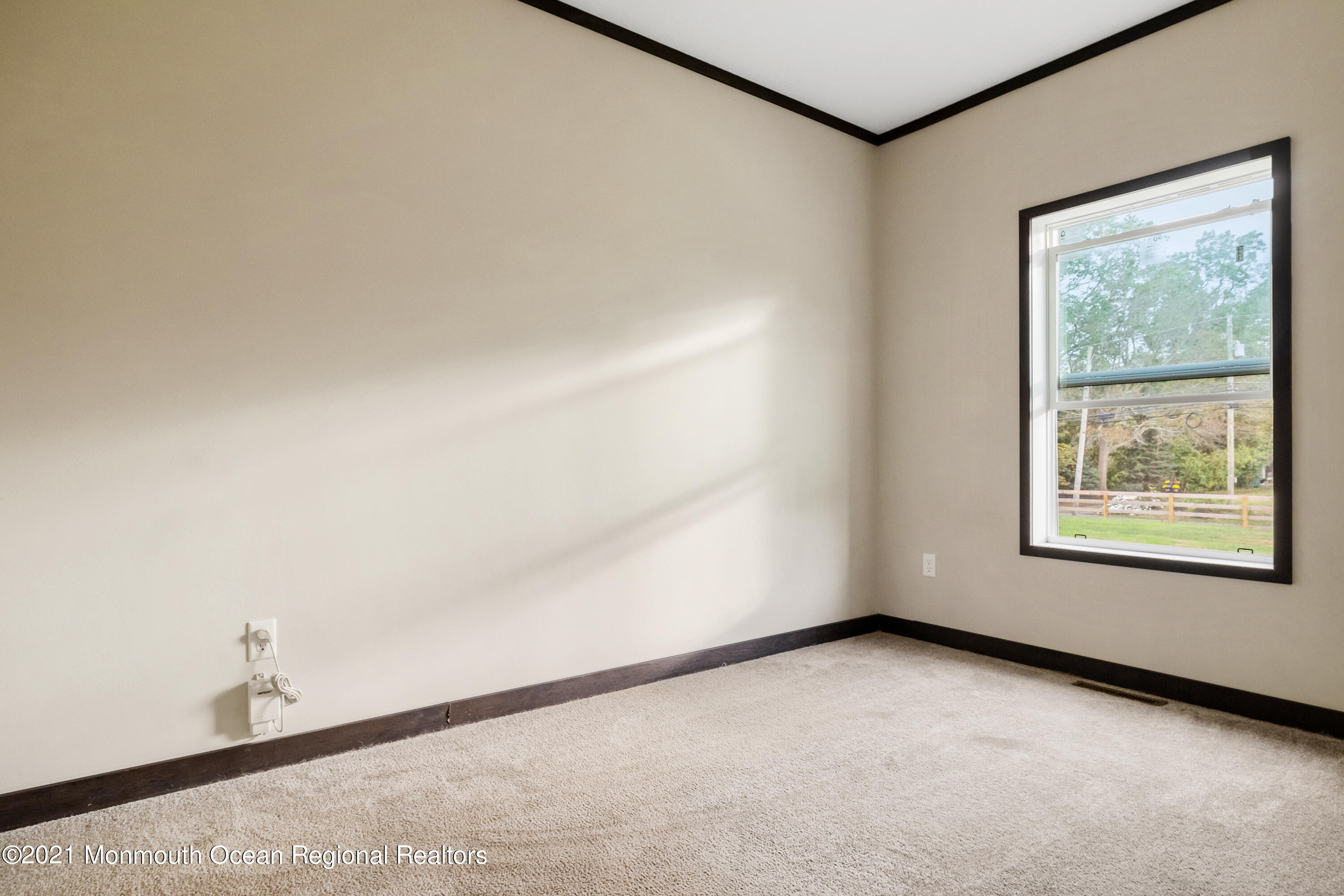 296 Trenton Lakewood Road Cream Ridge, NJ 08514 - Photo 20 of 35 a view of an empty room with a window