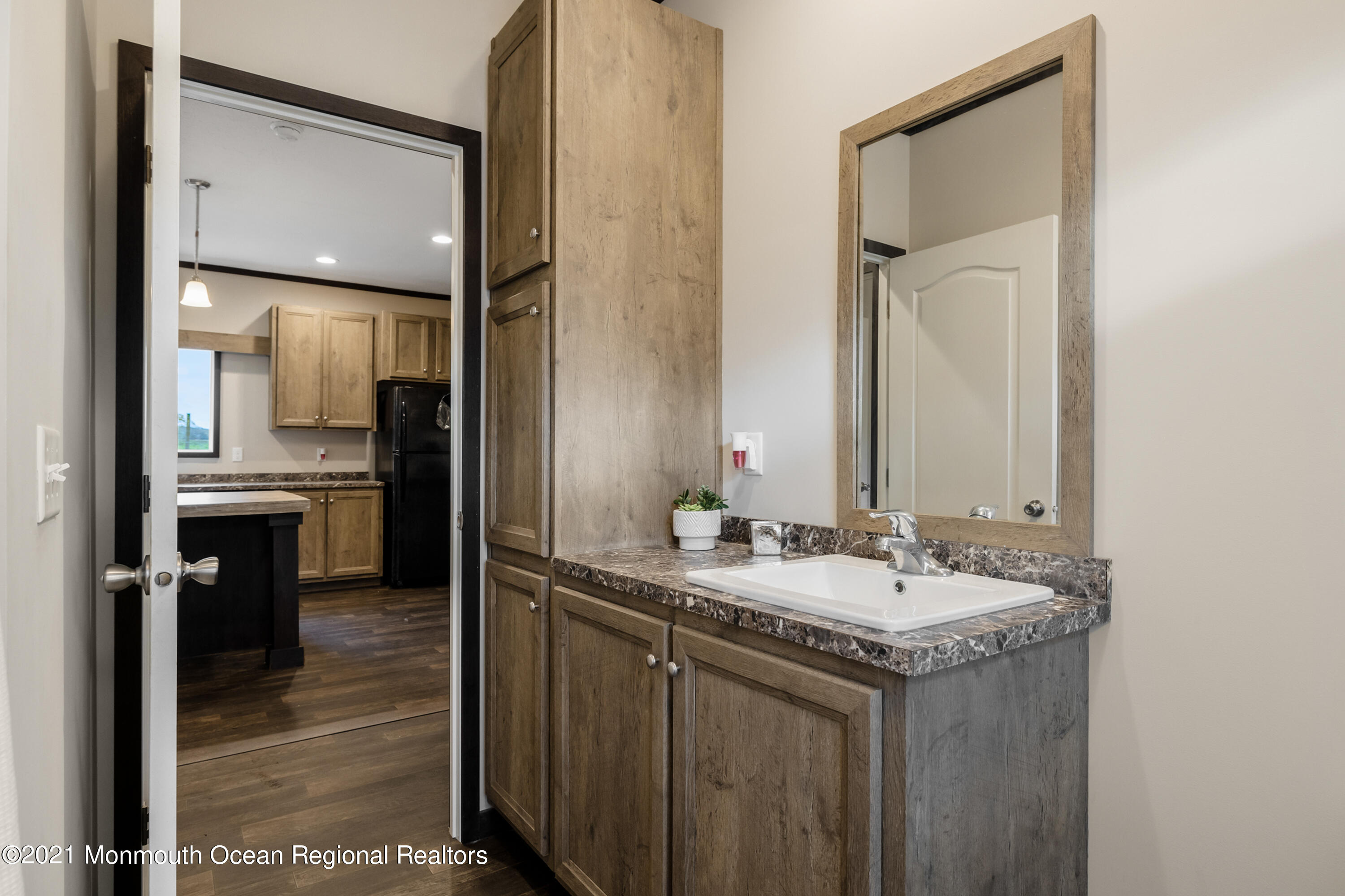 296 Trenton Lakewood Road Cream Ridge, NJ 08514 - Photo 23 of 35 a bathroom with a sink and a mirror