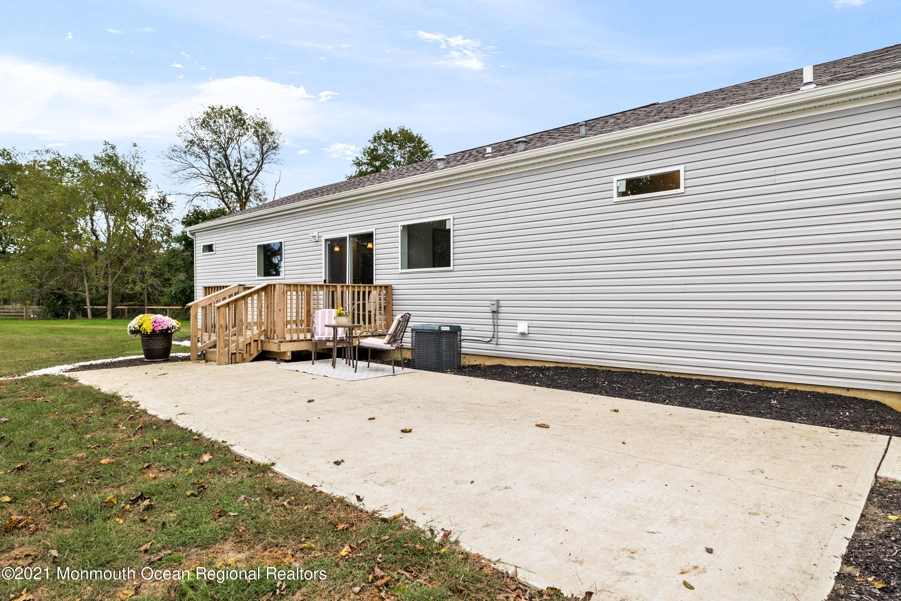 296 Trenton Lakewood Road Cream Ridge, NJ 08514 - Photo 28 of 35 a view of a white house with snow on the road