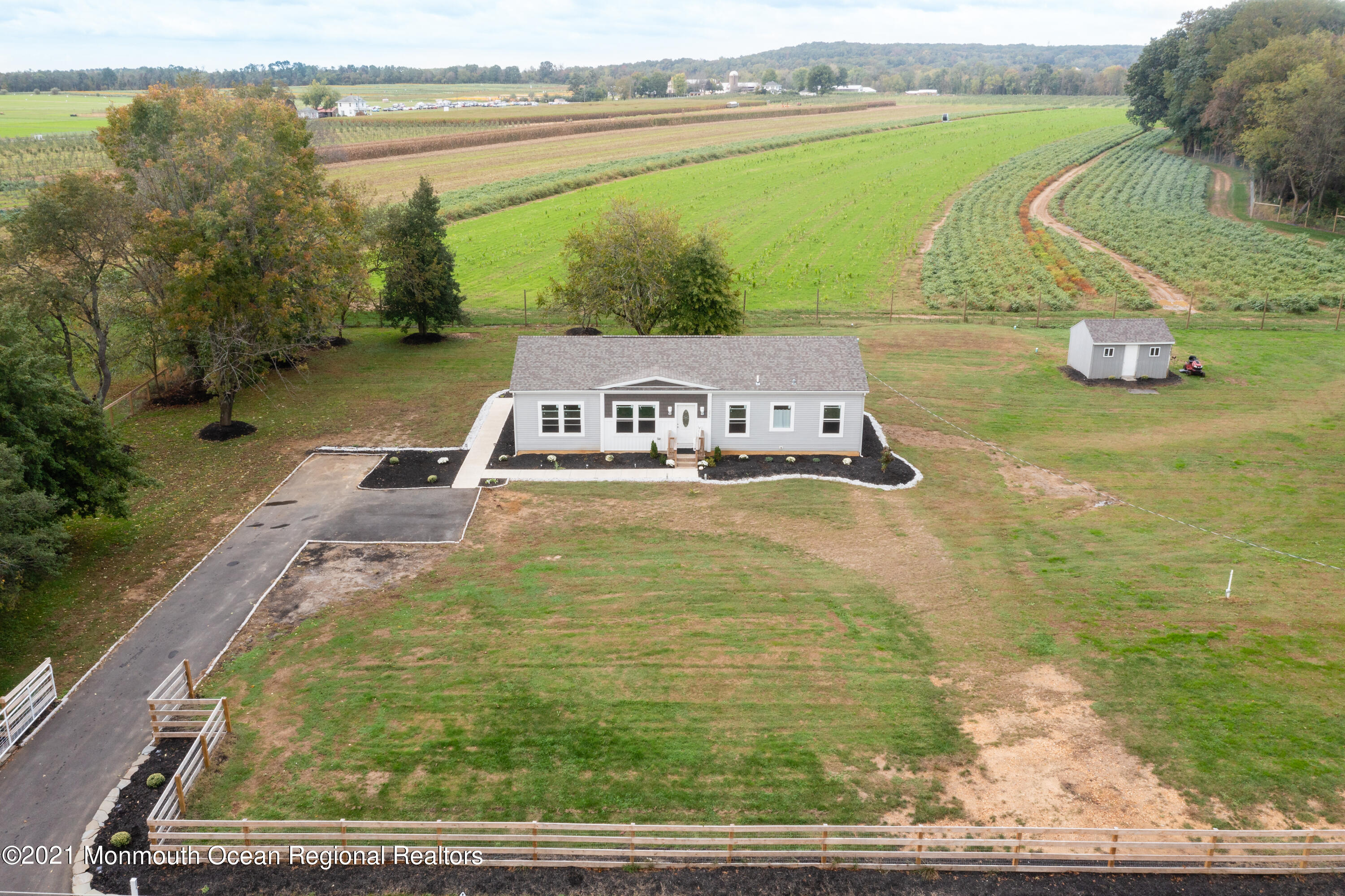 296 Trenton Lakewood Road Cream Ridge, NJ 08514 - Photo 29 of 35 a view of a swimming pool with an ocean view