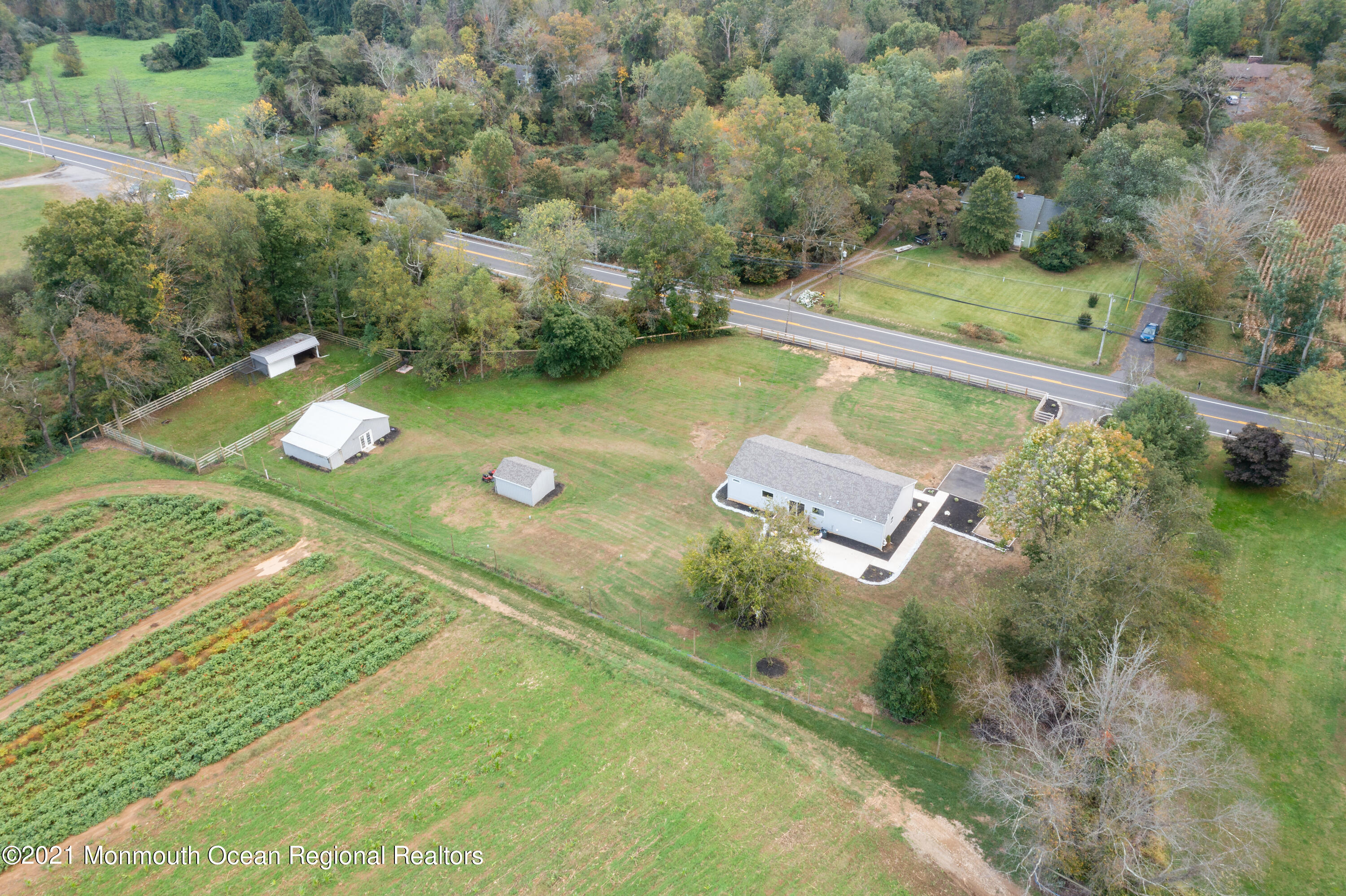 296 Trenton Lakewood Road Cream Ridge, NJ 08514 - Photo 31 of 35 an aerial view of a house with a yard