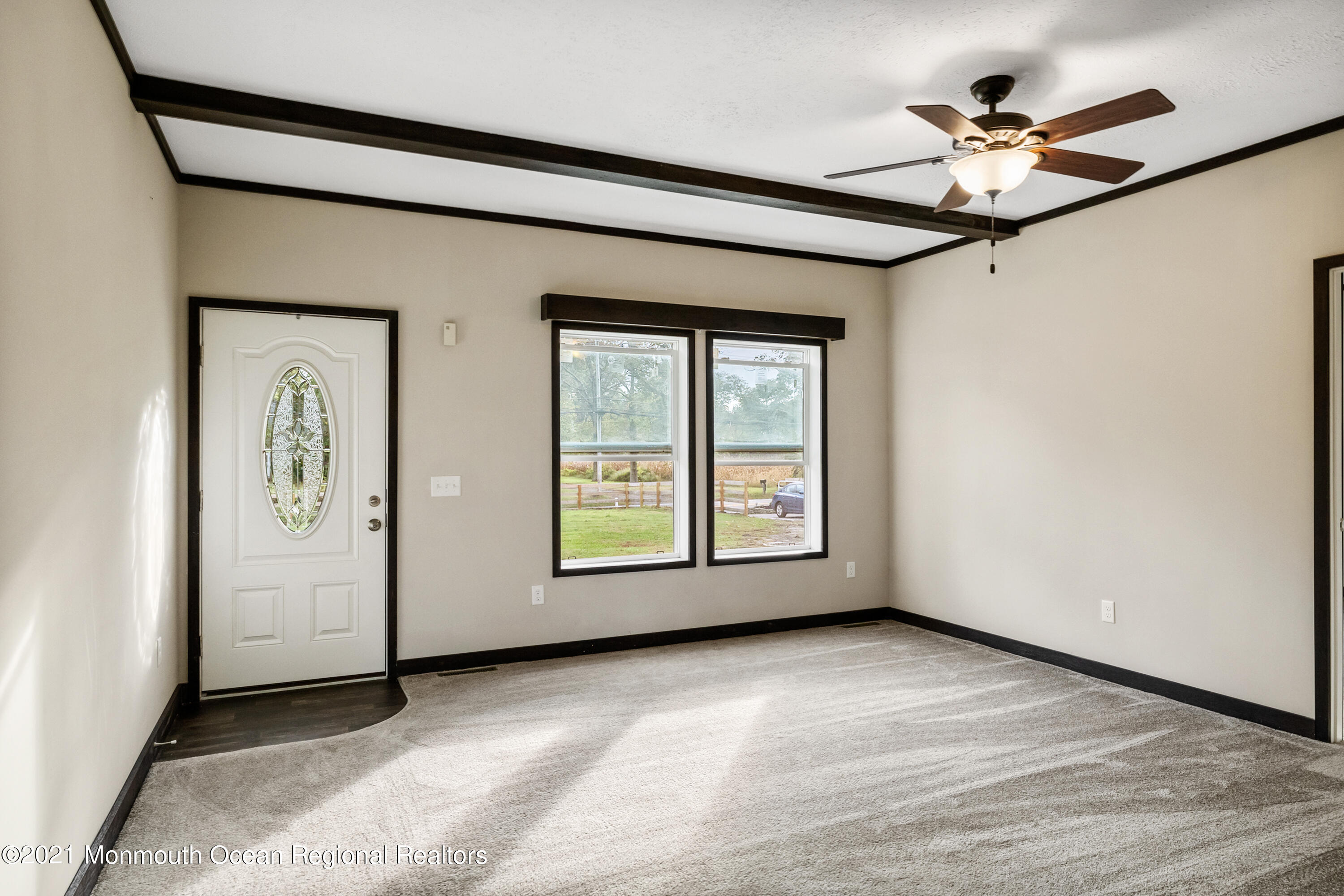 296 Trenton Lakewood Road Cream Ridge, NJ 08514 - Photo 9 of 35 an empty room with fan and windows