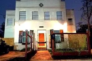 a balcony with next to a yard