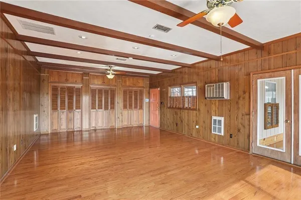 a view of an entryway with wooden floor
