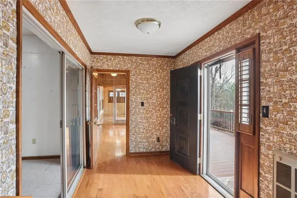 a view of a hallway with windows