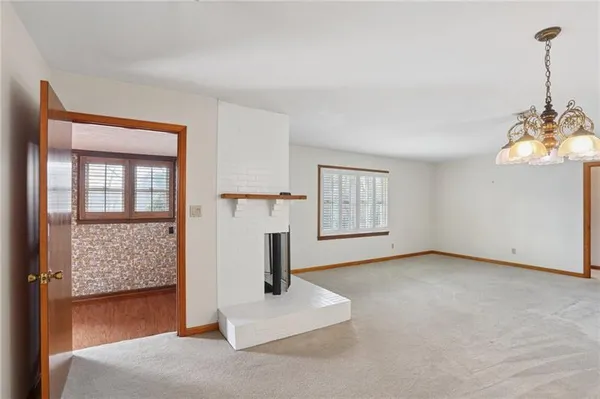 a view of empty room with windows