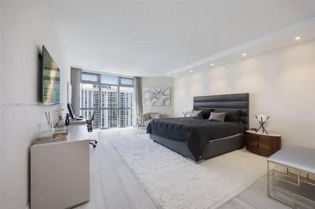 a bedroom with a bed and a couch