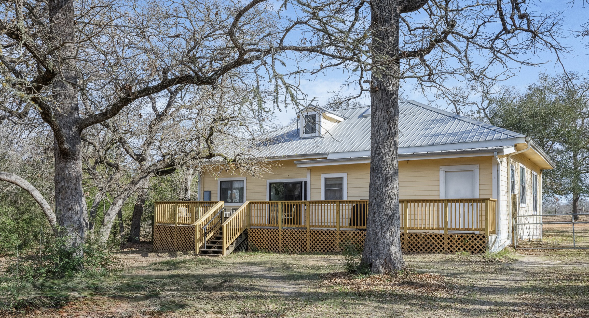1139 Private Road 7009 Road Lexington, TX 78947 - Photo 19 of 32 a view of a house with a yard