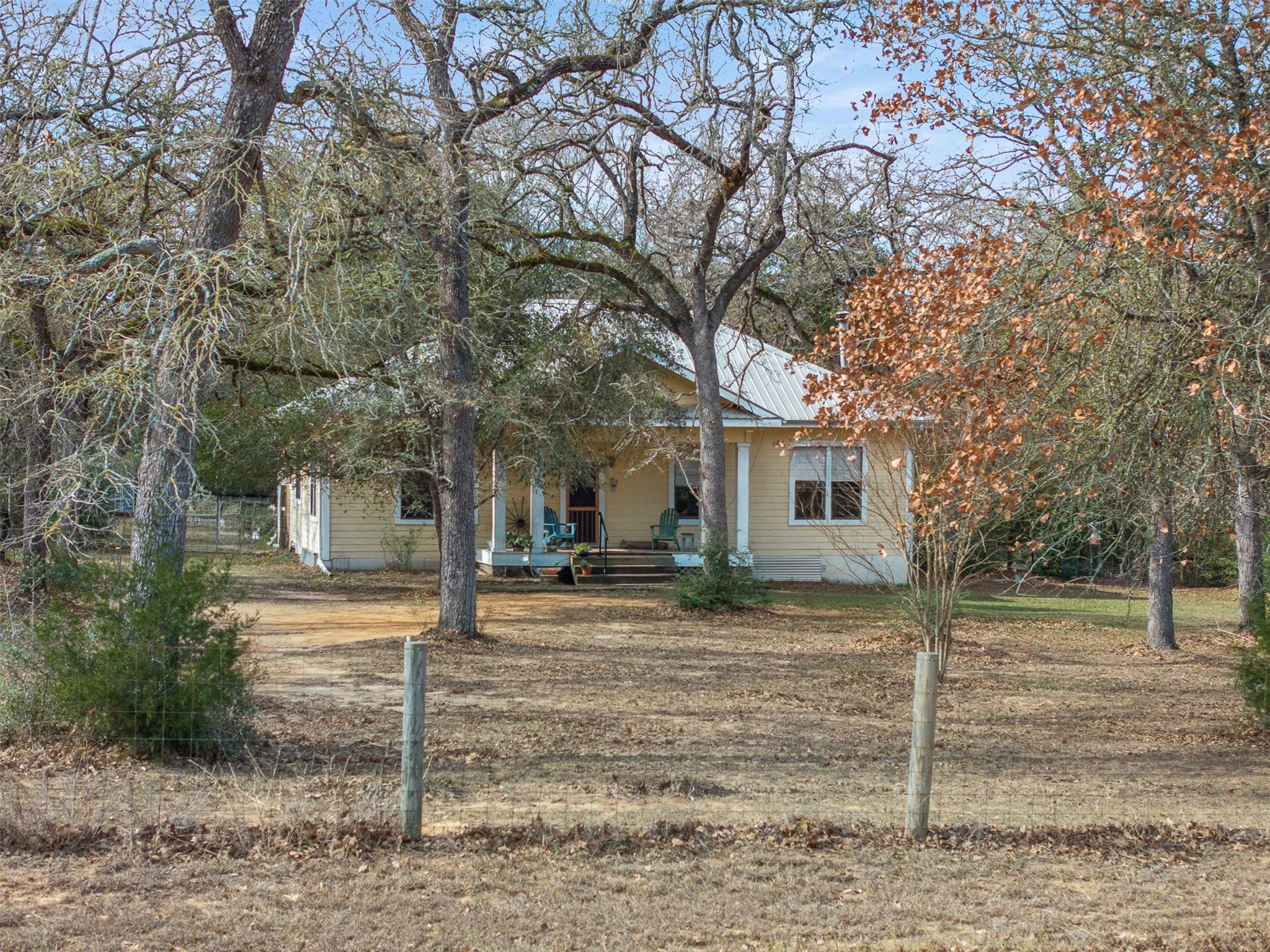 1139 Private Road 7009 Road Lexington, TX 78947 - Photo 25 of 32 a view of a house with a yard