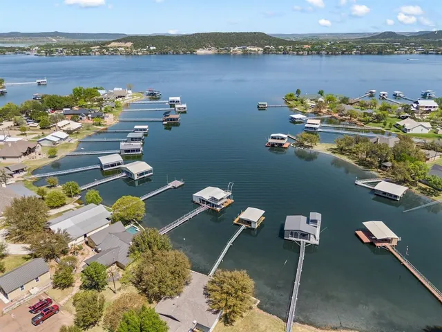 an aerial view of a house with a lake view