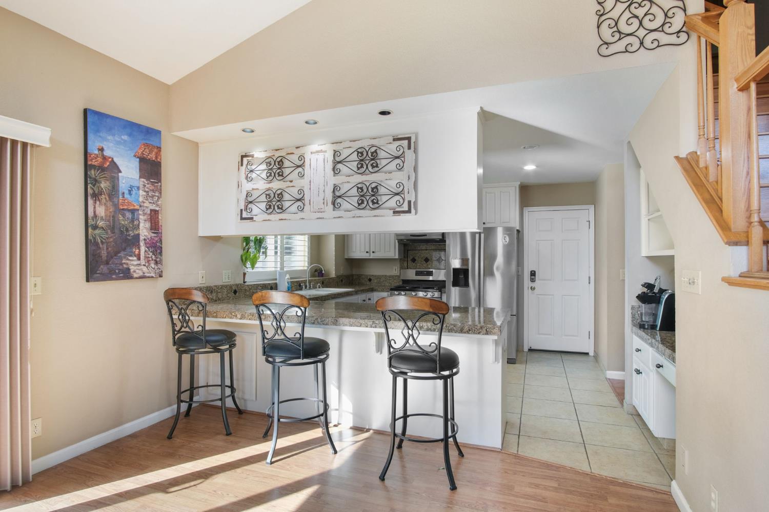 1345 Alex Circle Turlock, CA 95382 - Photo 13 of 35 a living room with stainless steel appliances kitchen island granite countertop furniture and a fireplace