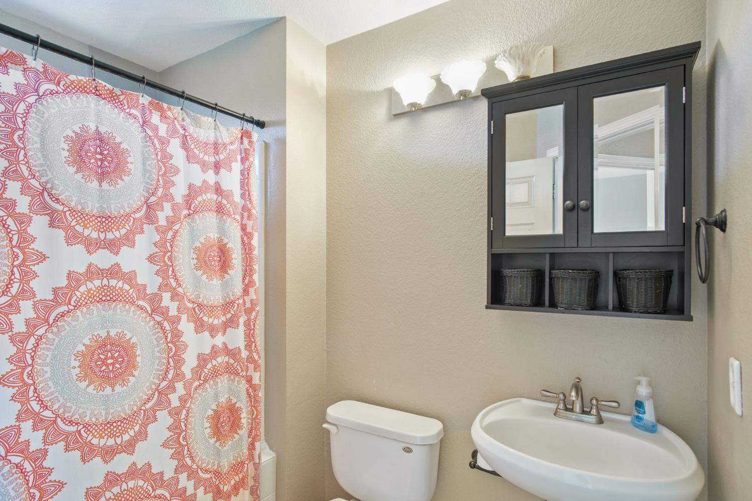 1345 Alex Circle Turlock, CA 95382 - Photo 20 of 35 a bathroom with a sink and a mirror