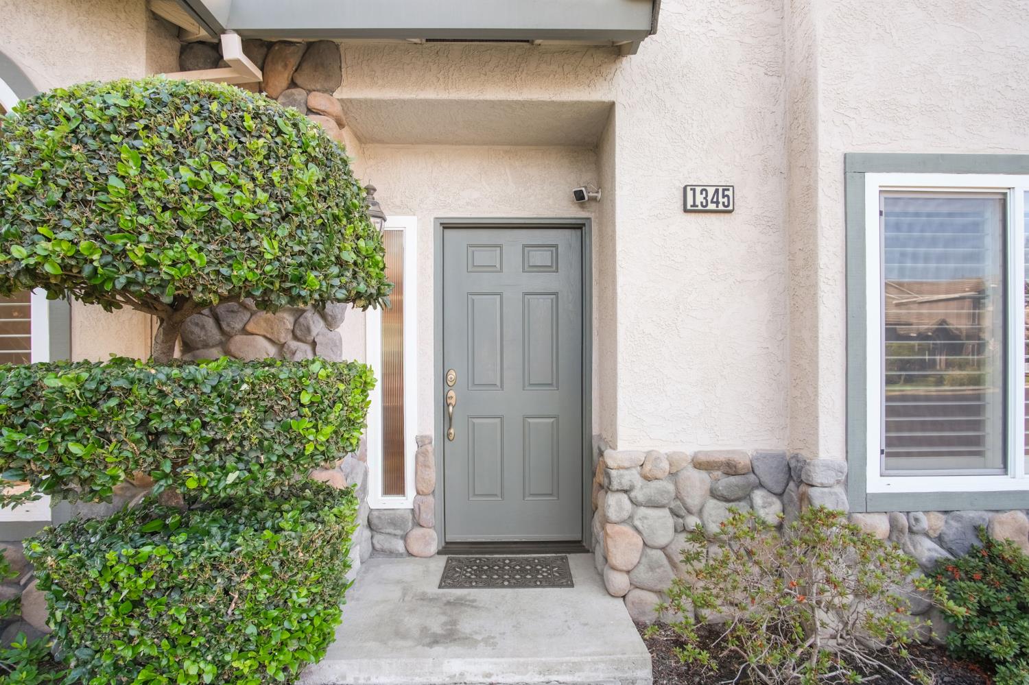 1345 Alex Circle Turlock, CA 95382 - Photo 2 of 35 a front view of a house with a garden