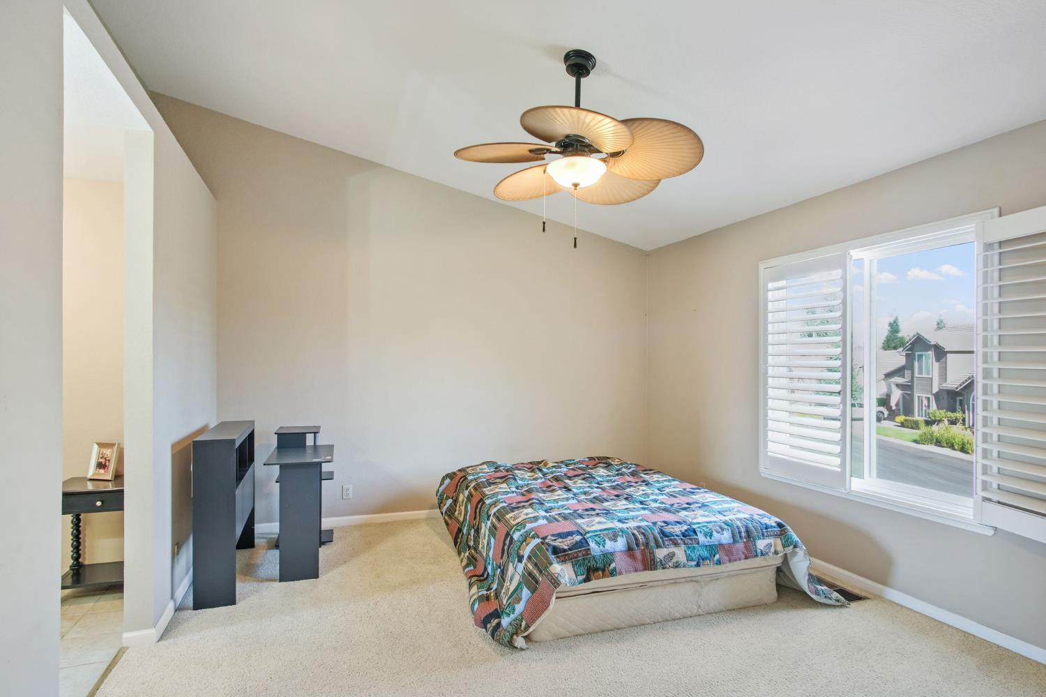 1345 Alex Circle Turlock, CA 95382 - Photo 23 of 35 a bedroom with a bed and a chandelier