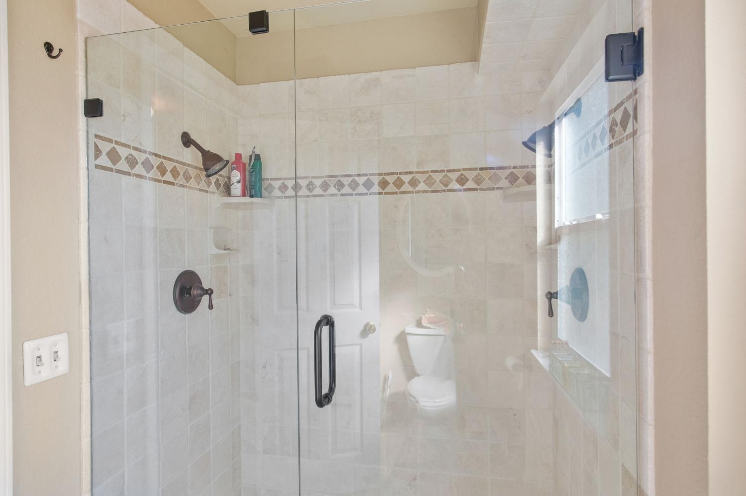 1345 Alex Circle Turlock, CA 95382 - Photo 27 of 35 a bathroom with a shower