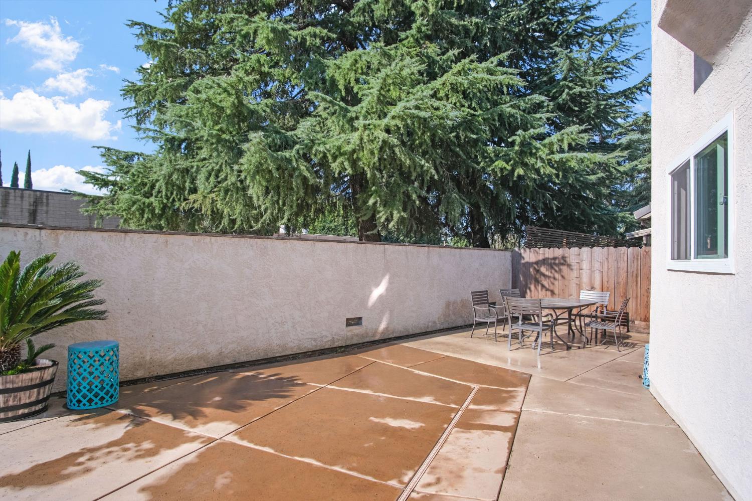 1345 Alex Circle Turlock, CA 95382 - Photo 33 of 35 a terrace with outdoor seating and trees