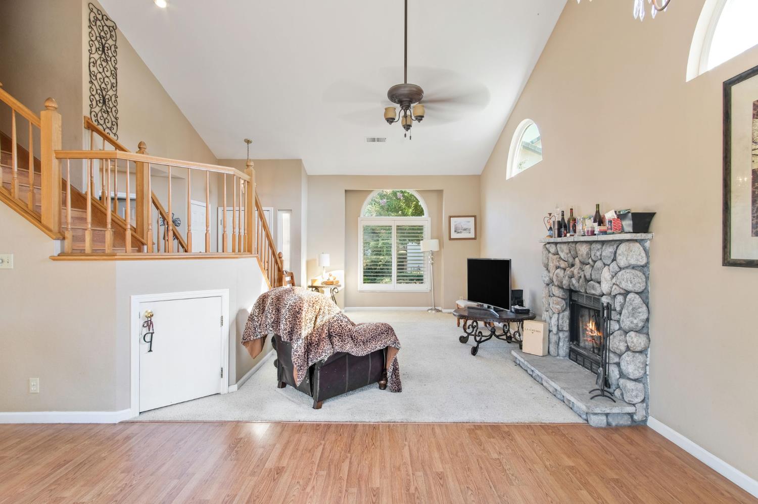 1345 Alex Circle Turlock, CA 95382 - Photo 9 of 35 a living room with furniture a fireplace and a flat screen tv