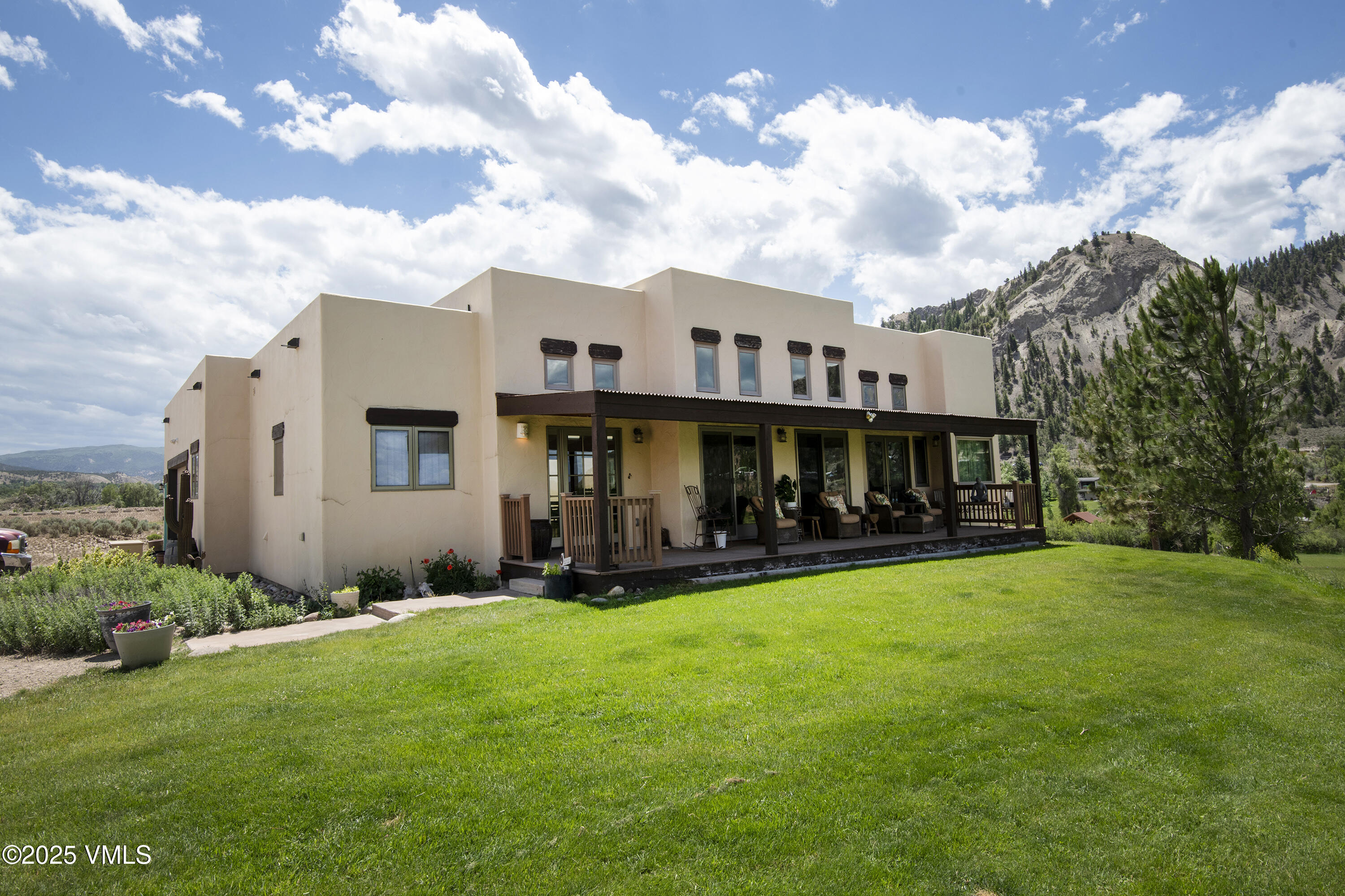 14555 Highway 6 Eagle, CO 81631 - Photo 1 of 61 a view of a house with backyard and sitting area