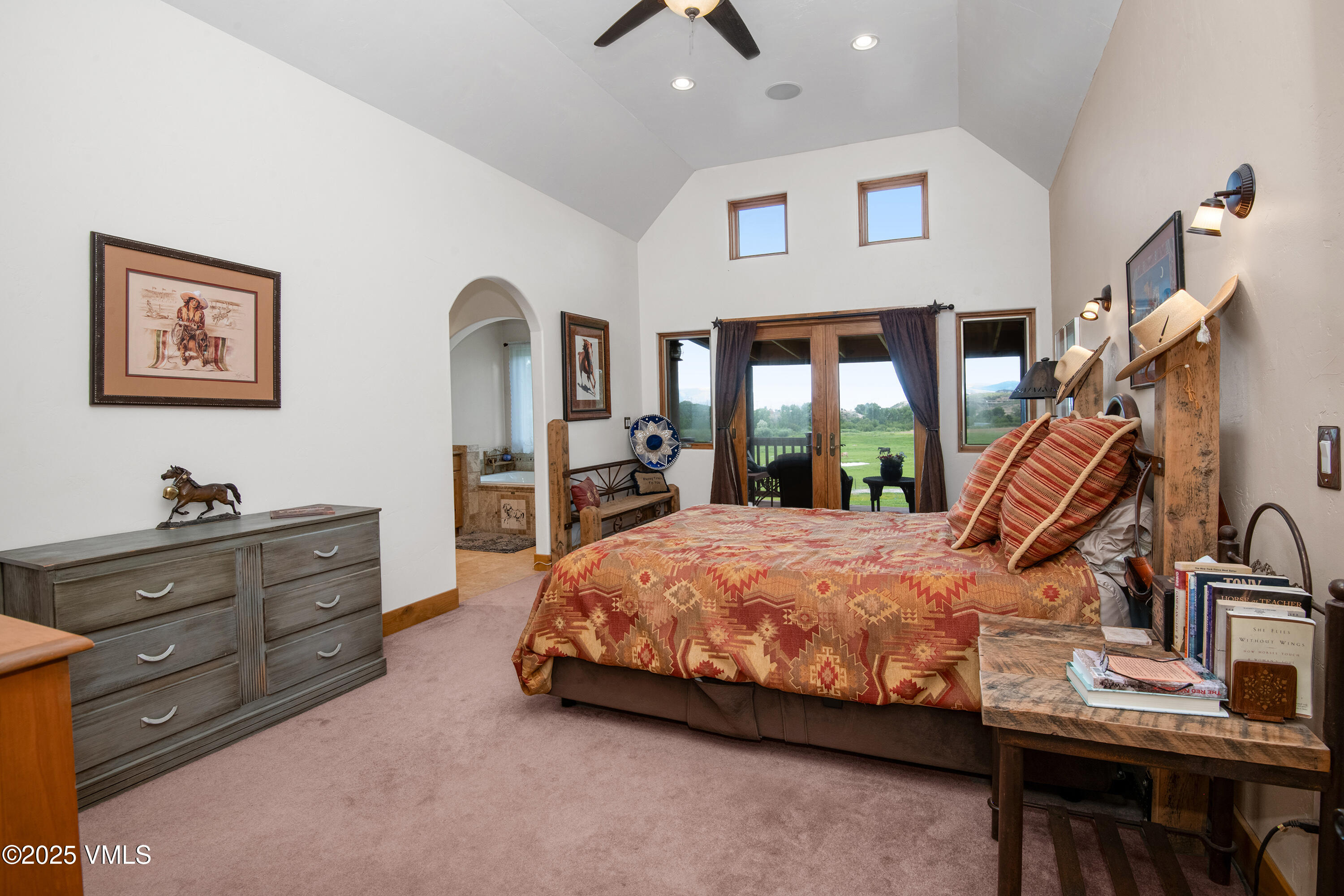 14555 Highway 6 Eagle, CO 81631 - Photo 14 of 61 a bedroom with a bed and a flat tv screen on dresser
