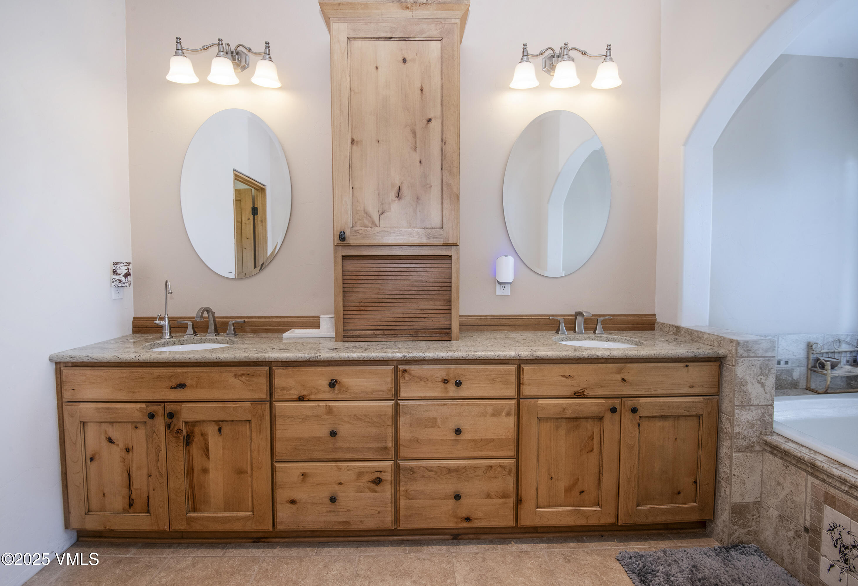 14555 Highway 6 Eagle, CO 81631 - Photo 17 of 61 a bathroom with a double vanity sink and a mirror