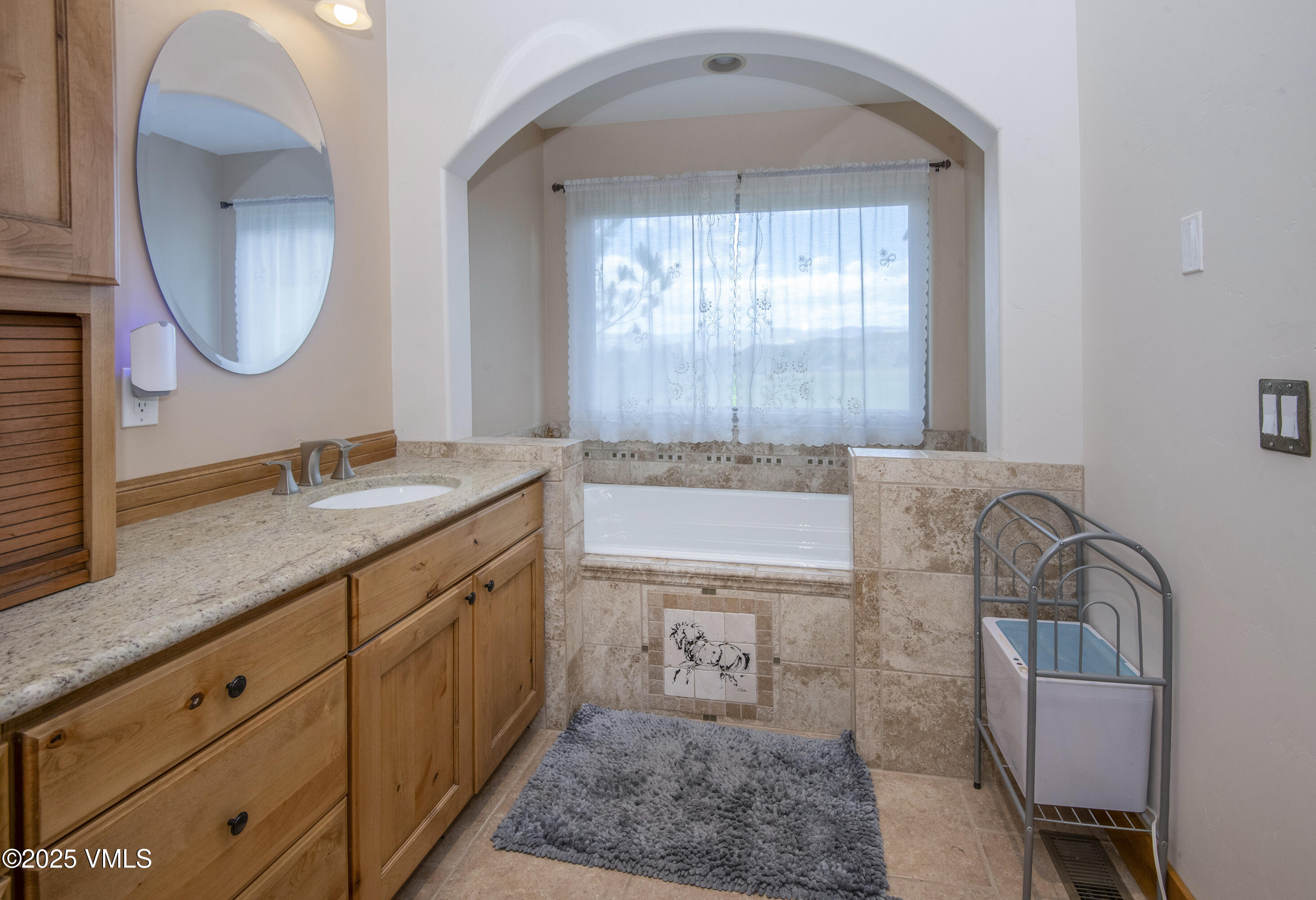 14555 Highway 6 Eagle, CO 81631 - Photo 18 of 61 a spacious bathroom with a granite countertop sink mirror and vanity