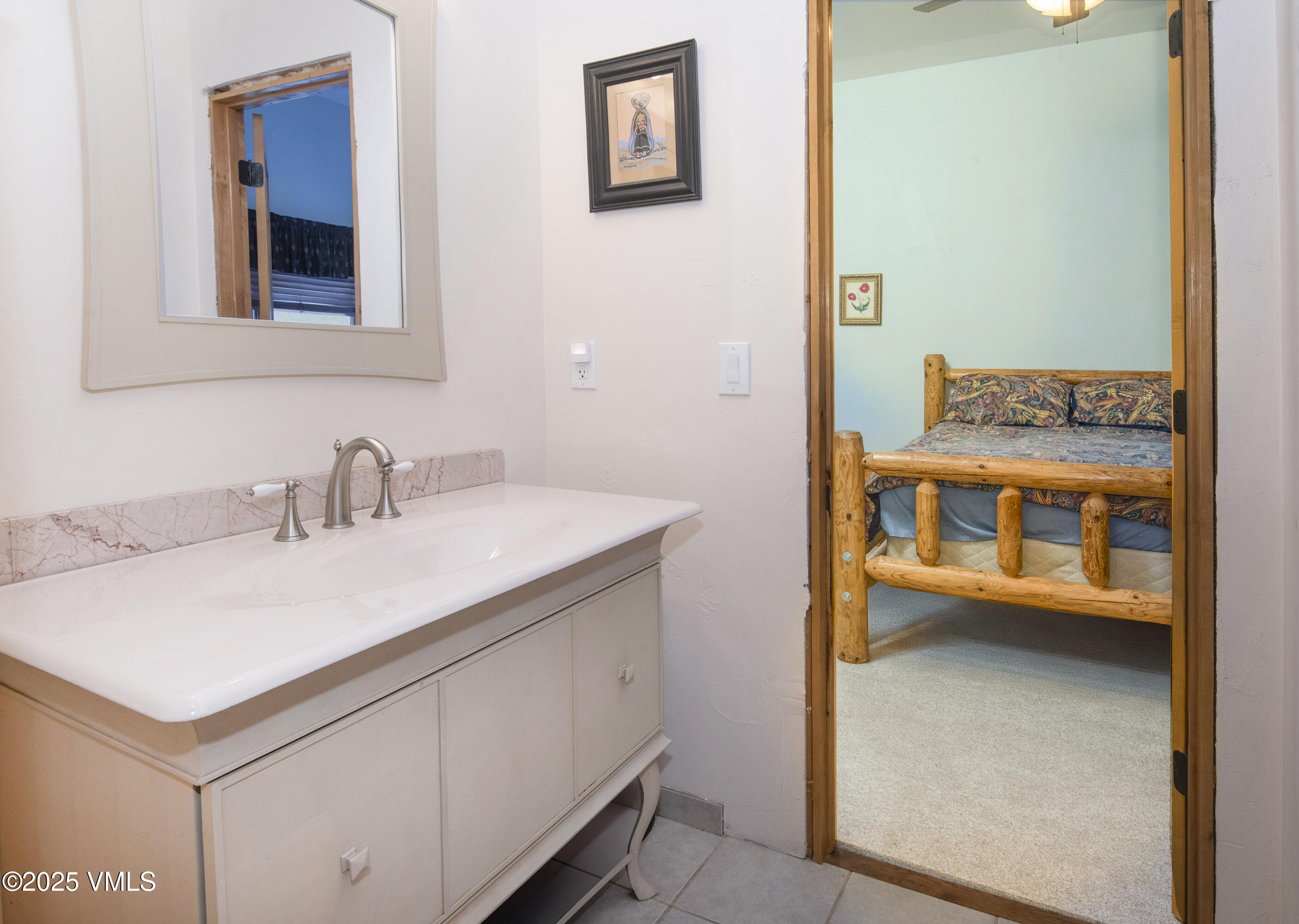 14555 Highway 6 Eagle, CO 81631 - Photo 23 of 61 a en suite bathroom with a sink and a mirror