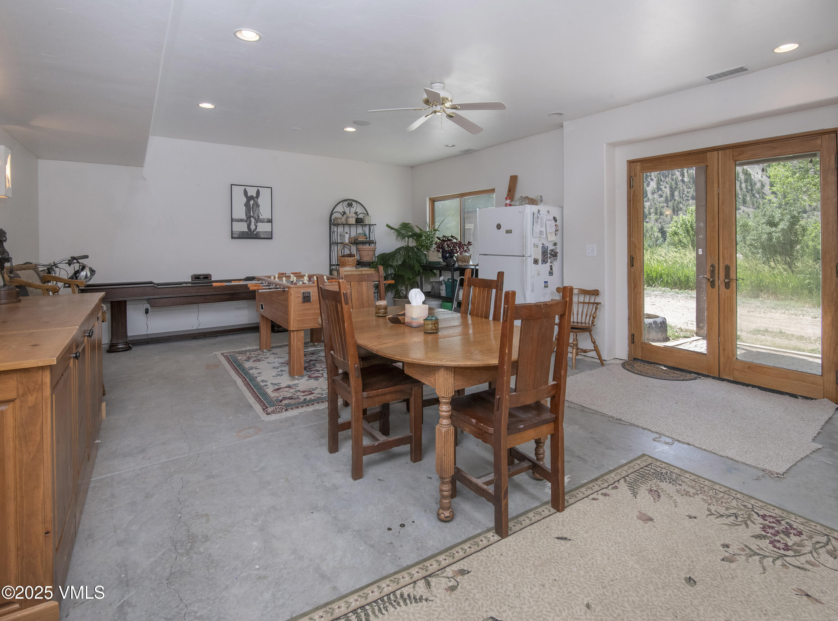 14555 Highway 6 Eagle, CO 81631 - Photo 27 of 61 a view of a dining room with furniture and a large window