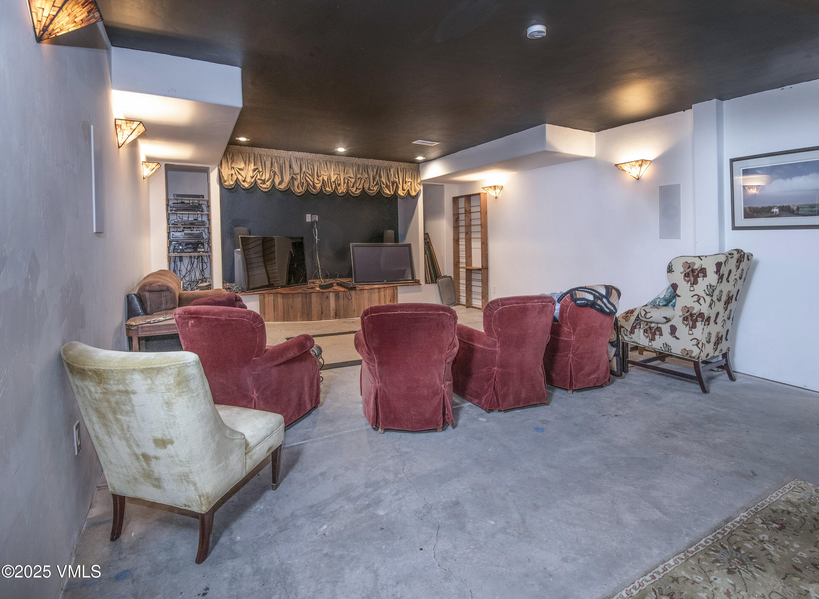 14555 Highway 6 Eagle, CO 81631 - Photo 29 of 61 a living room with furniture a lamp and a fireplace