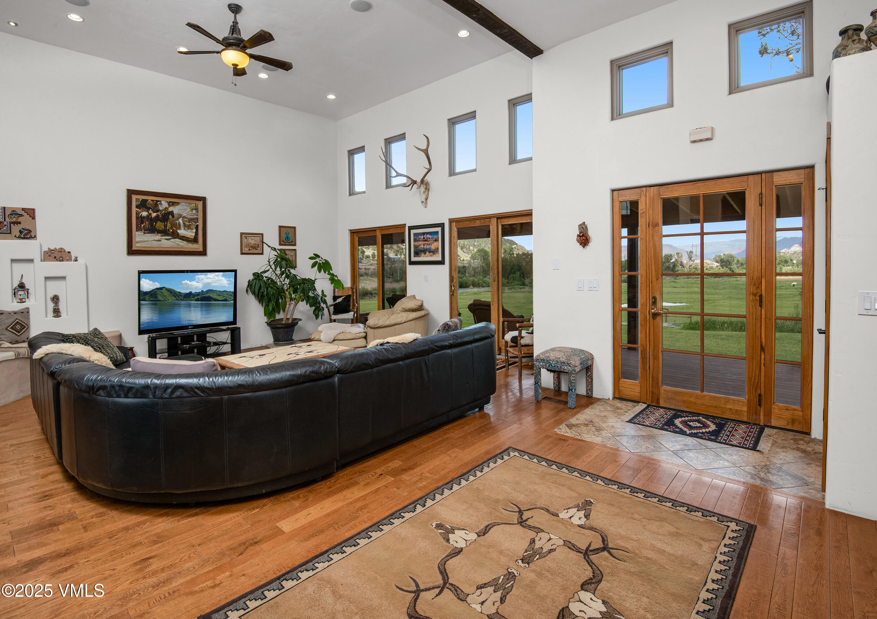 14555 Highway 6 Eagle, CO 81631 - Photo 3 of 61 a living room with furniture and a floor to ceiling window