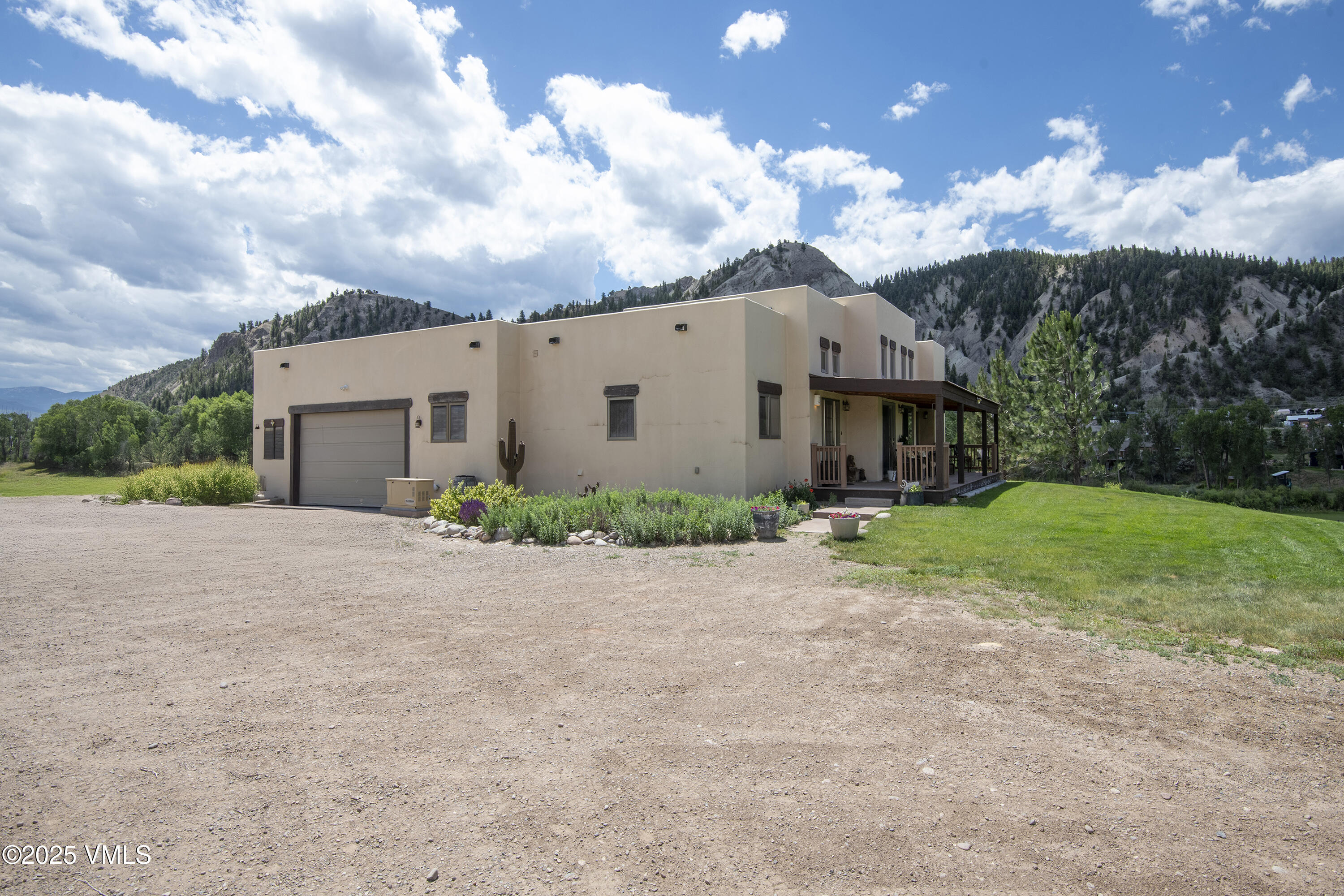 14555 Highway 6 Eagle, CO 81631 - Photo 32 of 61 a view of a house with backyard and garden