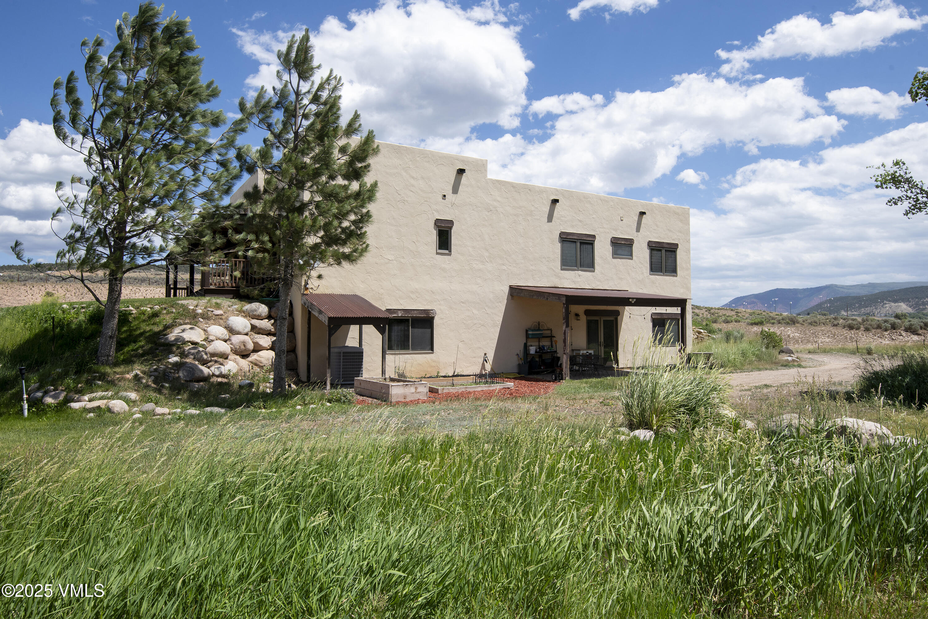 14555 Highway 6 Eagle, CO 81631 - Photo 35 of 61 a view of a house with a yard and sitting area