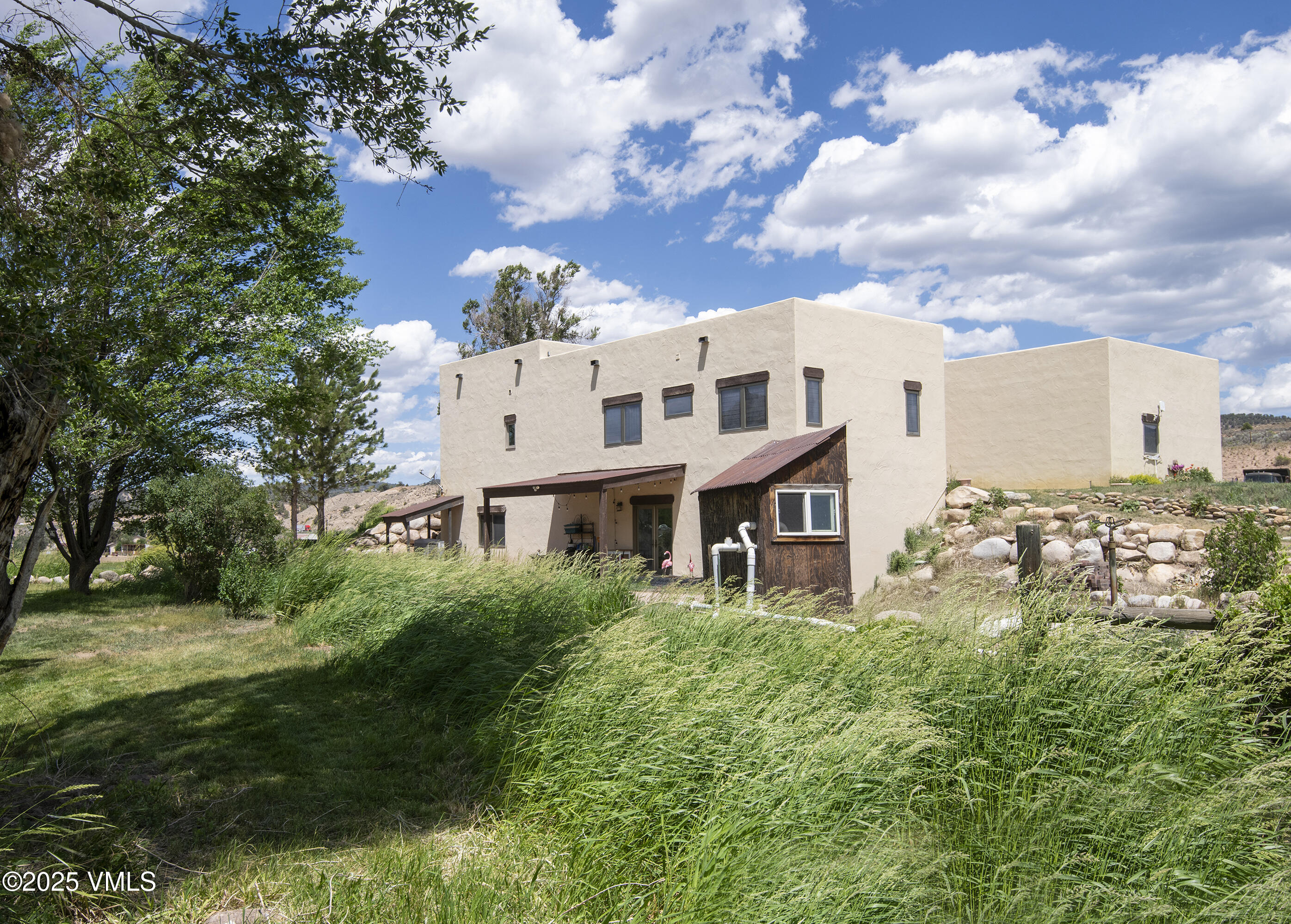 14555 Highway 6 Eagle, CO 81631 - Photo 36 of 61 a view of a big yard with plants and large trees