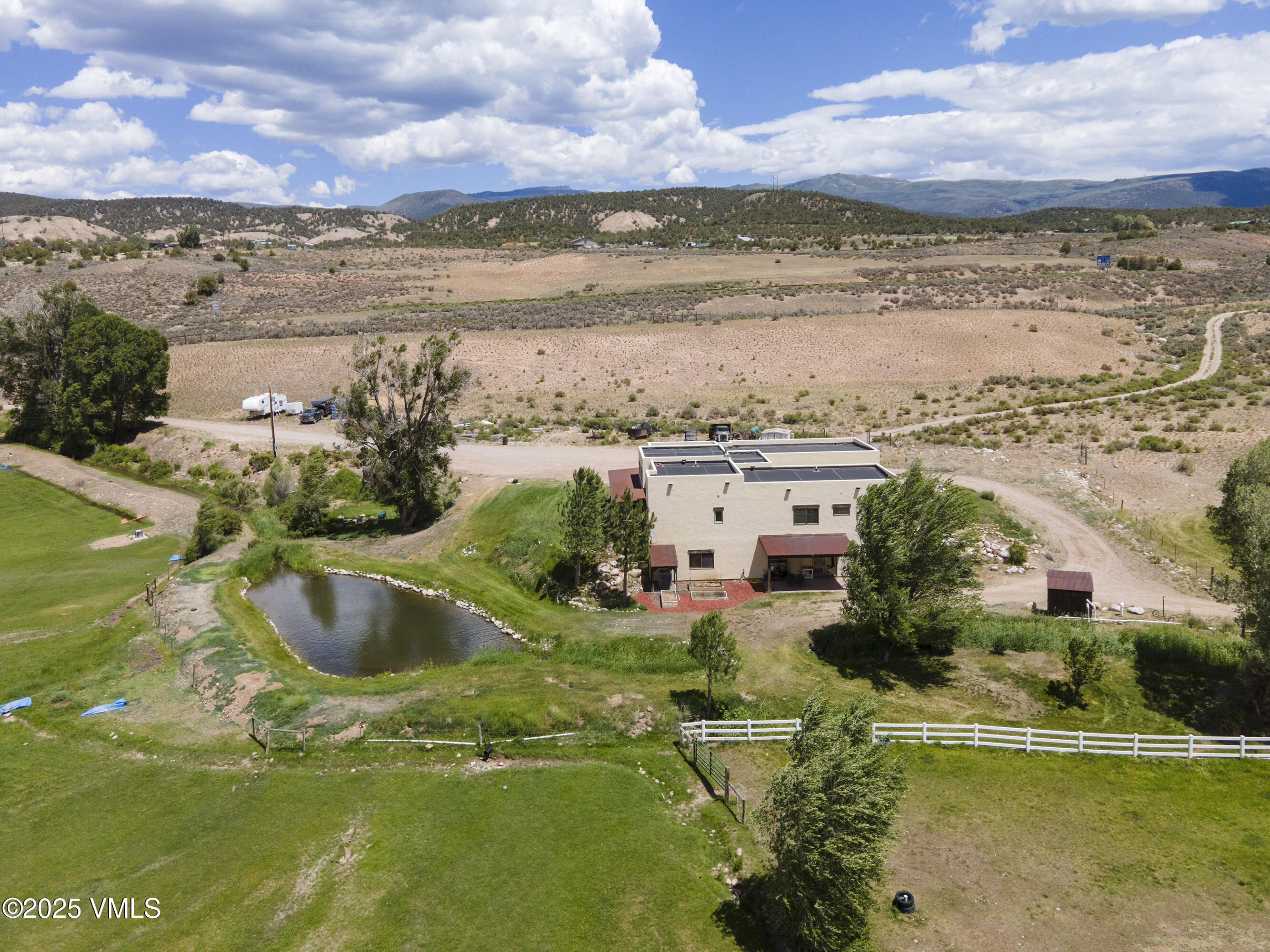 14555 Highway 6 Eagle, CO 81631 - Photo 41 of 61 a view of a lake with a building in the background