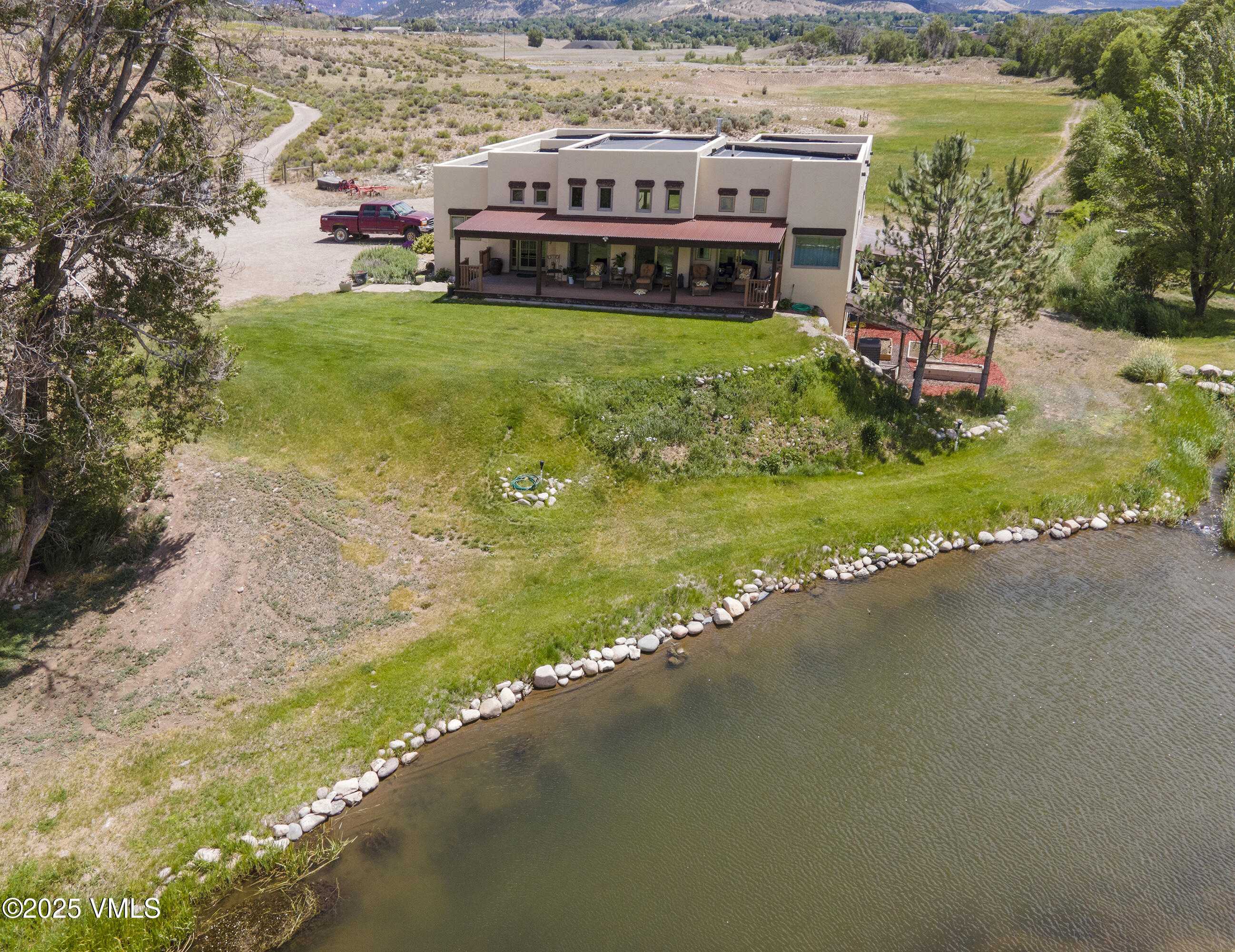 14555 Highway 6 Eagle, CO 81631 - Photo 44 of 61 a view of a lake with a building in the background